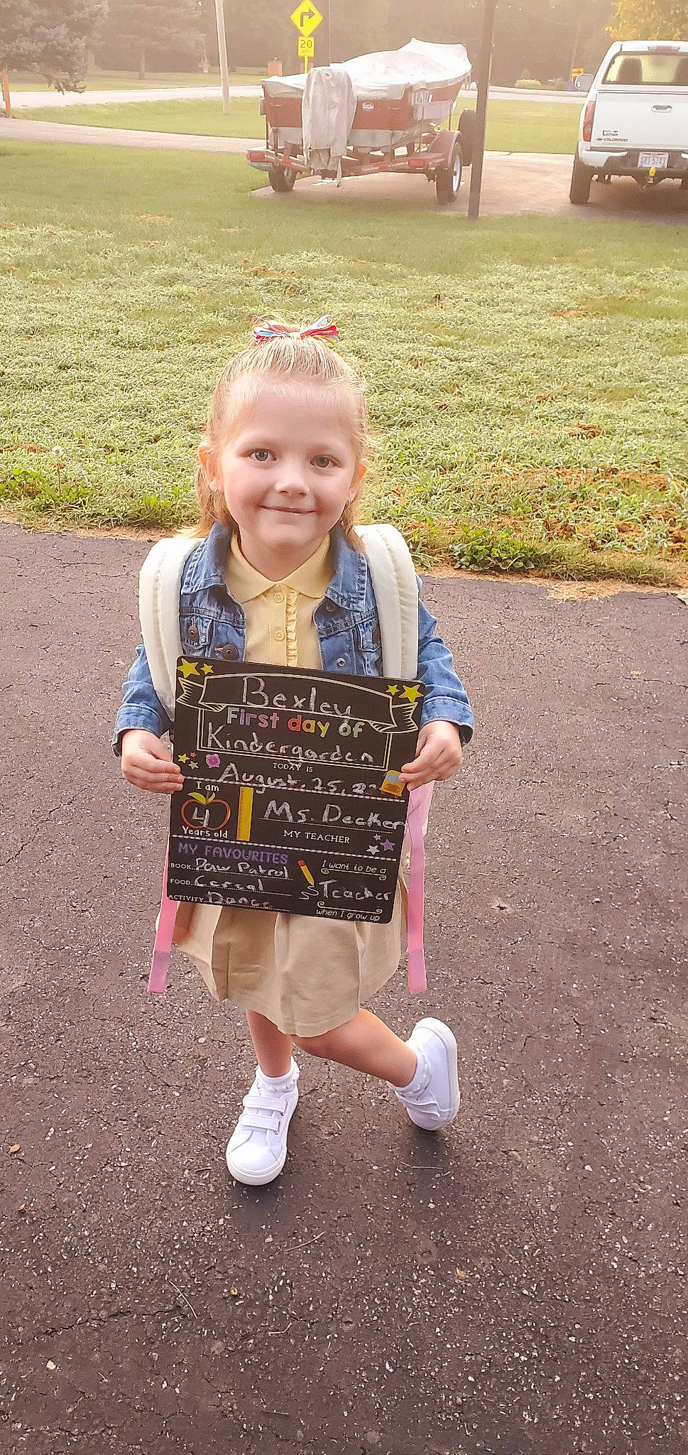 Bexley is registered to the contest to win money with this photo: asphalt, baby_toddler_clothing, child, dress, face, facial_expression, fun, grass, hand, handwriting, happy, head, joy, pattern, person, recreation, smile, spring, sunglasses, t_shirt