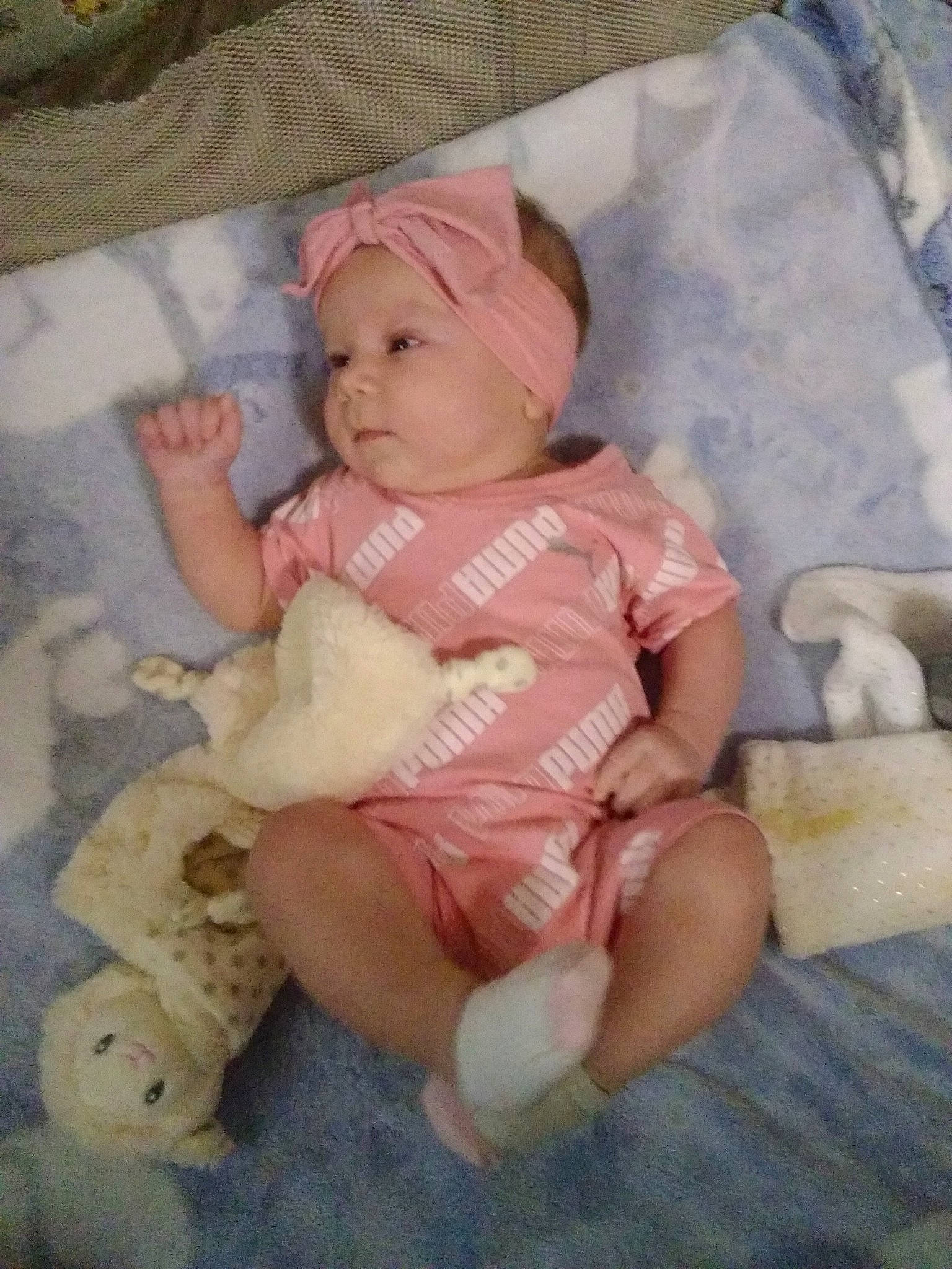 Braxlee is registered to the contest to win money with this photo: baby, baby_products, baby_toddler_clothing, cap, cheek, child, comfort, eye, hat, headwear, linens, pattern, peach, person, room, sitting, sleeve, toddler