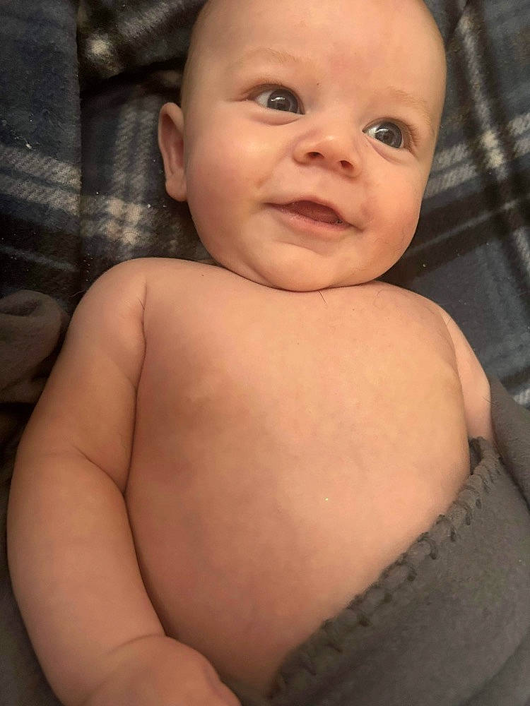 Colson is registered to the contest to win money with this photo: arm, baby, cheek, chest, eye, eyebrow, face, flash_photography, hand, head, human_body, iris, lip, neck, nose, person, skin, sleeve, smile, stomach