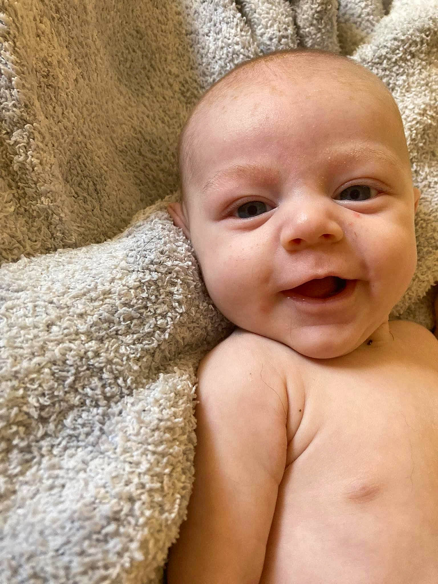 Colson is registered to the contest to win money with this photo: baby, baby_laughing, barechested, cheek, chest, child, close_up, eye, eyebrow, eyelash, grass, happy, lip, mouth, nose, person, skin, smile, stomach, toddler