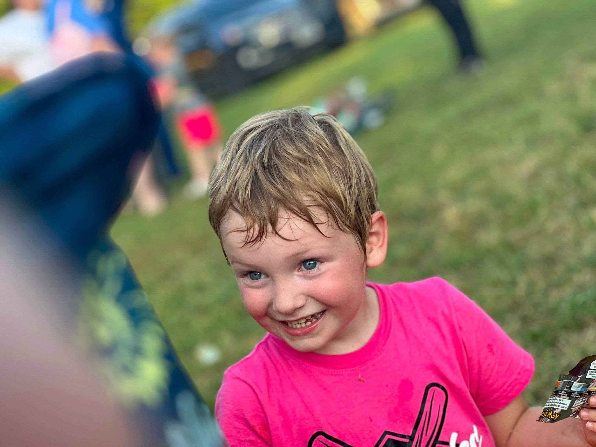 Daniel joined the competition — help win amazing prizes! camera, child, event, fun, grass, guitar, happy, joy, laugh, leisure, musical_instrument, person, play, recreation, single_lens_reflex_camera, sitting, smile, snapshot, soil, t_shirt