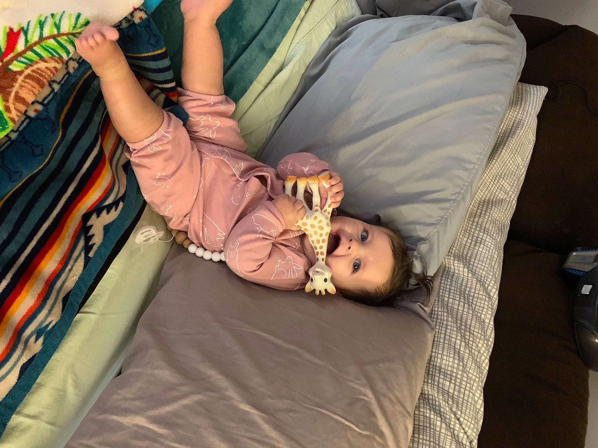 Norah joined the competition — help win amazing prizes! arm, baby, bag, child, comfort, fun, human, human_body, human_leg, joint, knee, leg, leisure, linens, person, room, sitting, textile, thigh, toddler