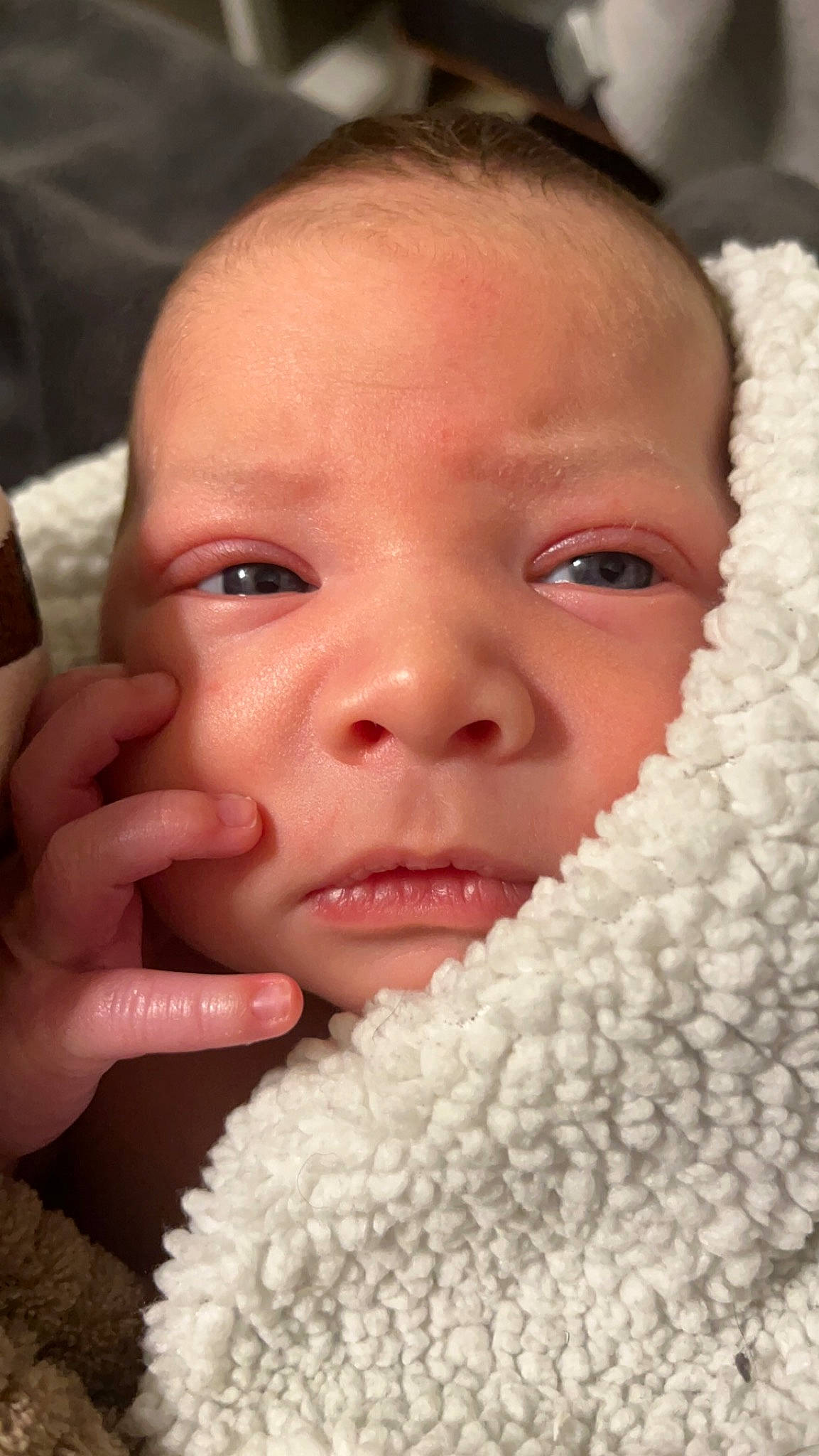 Micah is registered to the contest to win money with this photo: baby, cheek, chin, ear, eye, eyebrow, eyelash, face, facial_expression, finger, gesture, happy, human, iris, lip, mouth, nose, organ, person, photograph