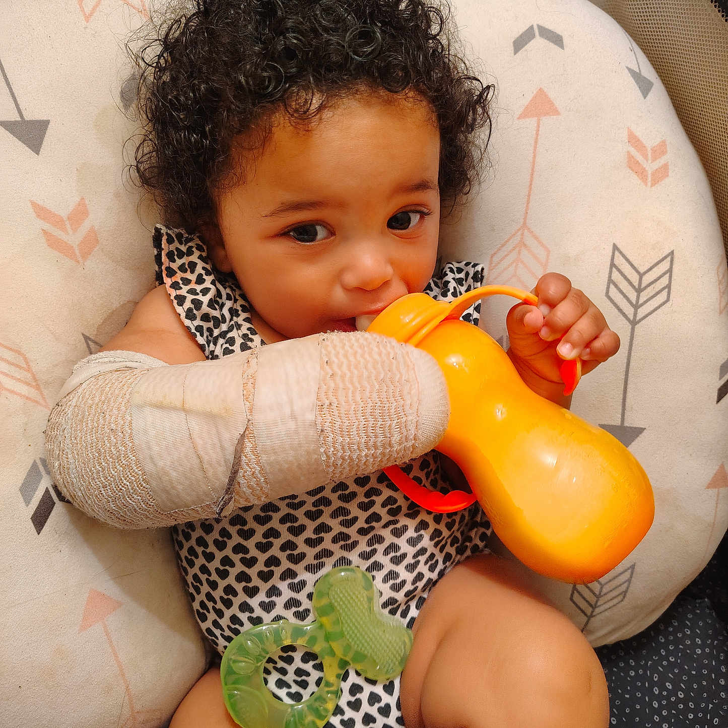 Bernardina joined the competition — help win amazing prizes! baby, bandage, child, closeup, comfort, curly_hair, cushion, cute, eyes, face, hand, indoors, infant, patterned_clothing, portrait, sippy_cup, sitting, skin, teething_toy, toy