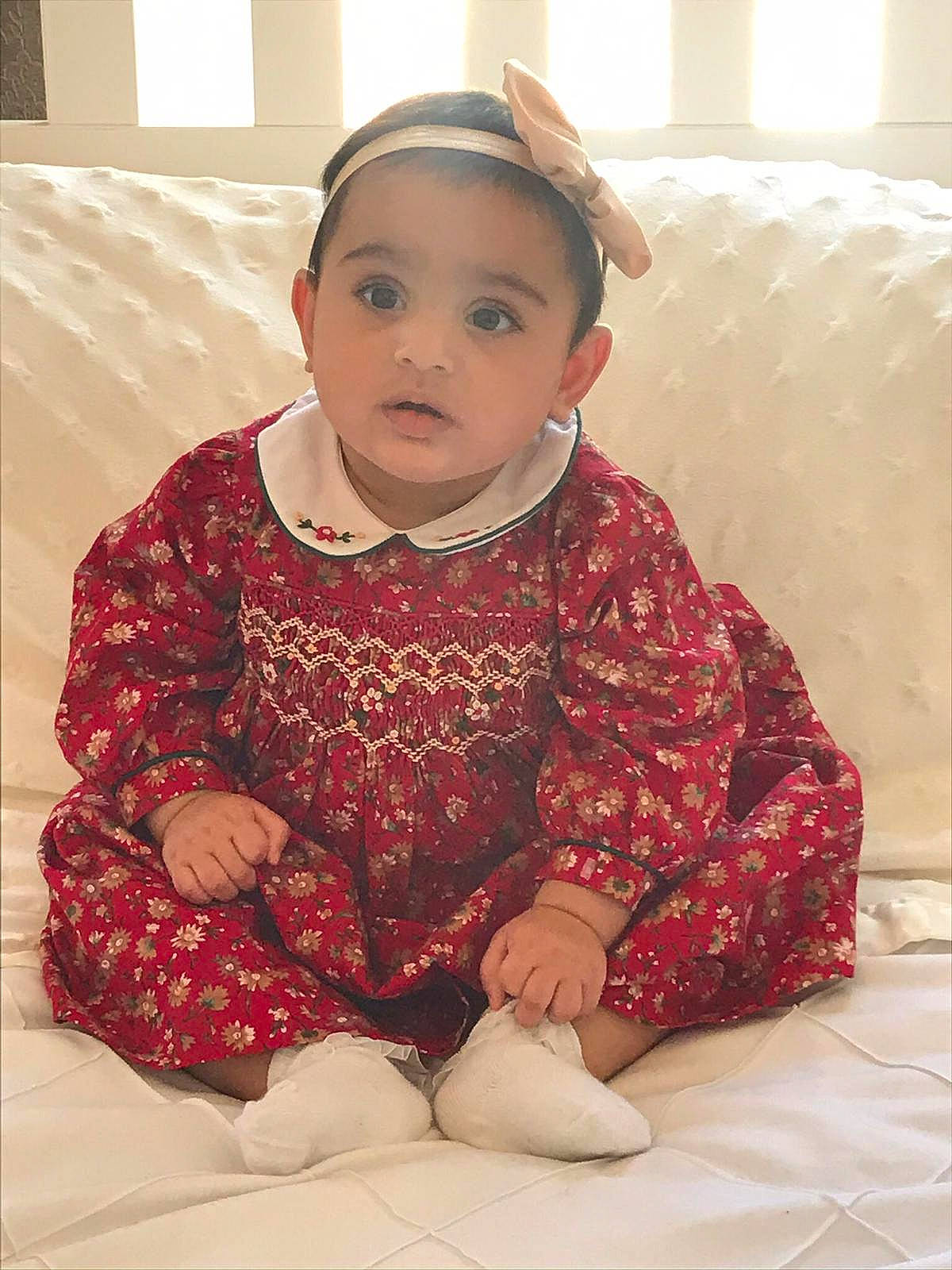 Aisha joined the competition — help win amazing prizes! baby, cheek, child, eye, face, head, outerwear, pattern, people, person, sitting, skin, sleeve, smile, toddler