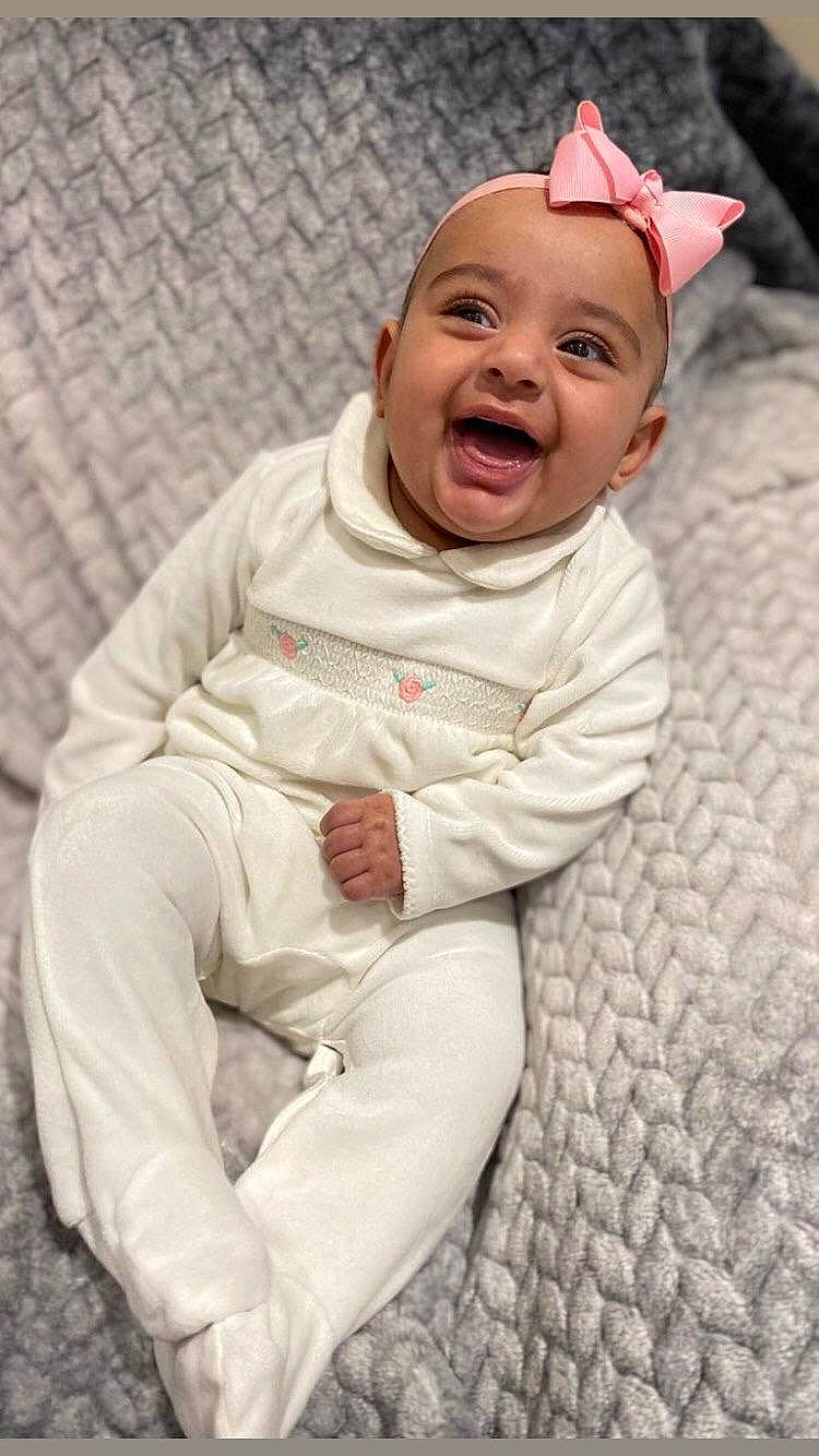 Aisha joined the competition — help win amazing prizes! baby, baby_laughing, cheek, child, facial_expression, happy, headwear, laugh, person, skin, smile, toddler