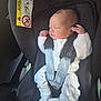 baby, newborn, car_seat, infant, child, white_clothing, knitwear, sleeping, car_interior, seatbelt, safety, cute, small_hands, patterned_pants, footwear, resting, peaceful, seat, child_safety, portrait