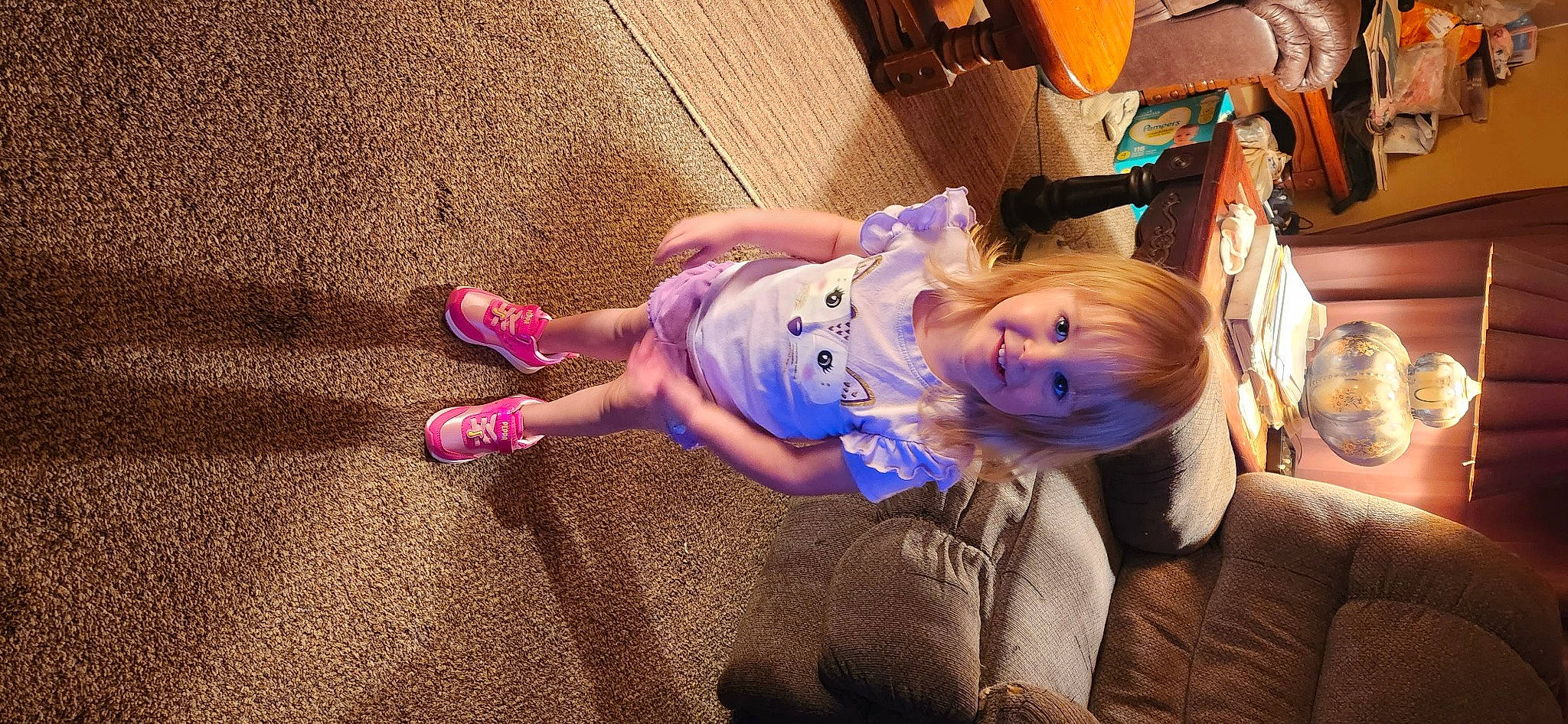 Brinlee is registered to the contest to win money with this photo: baby, baby_toddler_clothing, child, electric_blue, event, flooring, fun, happy, hat, human_leg, joy, leisure, magenta, person, purple, recreation, sitting, smile, toddler, tree