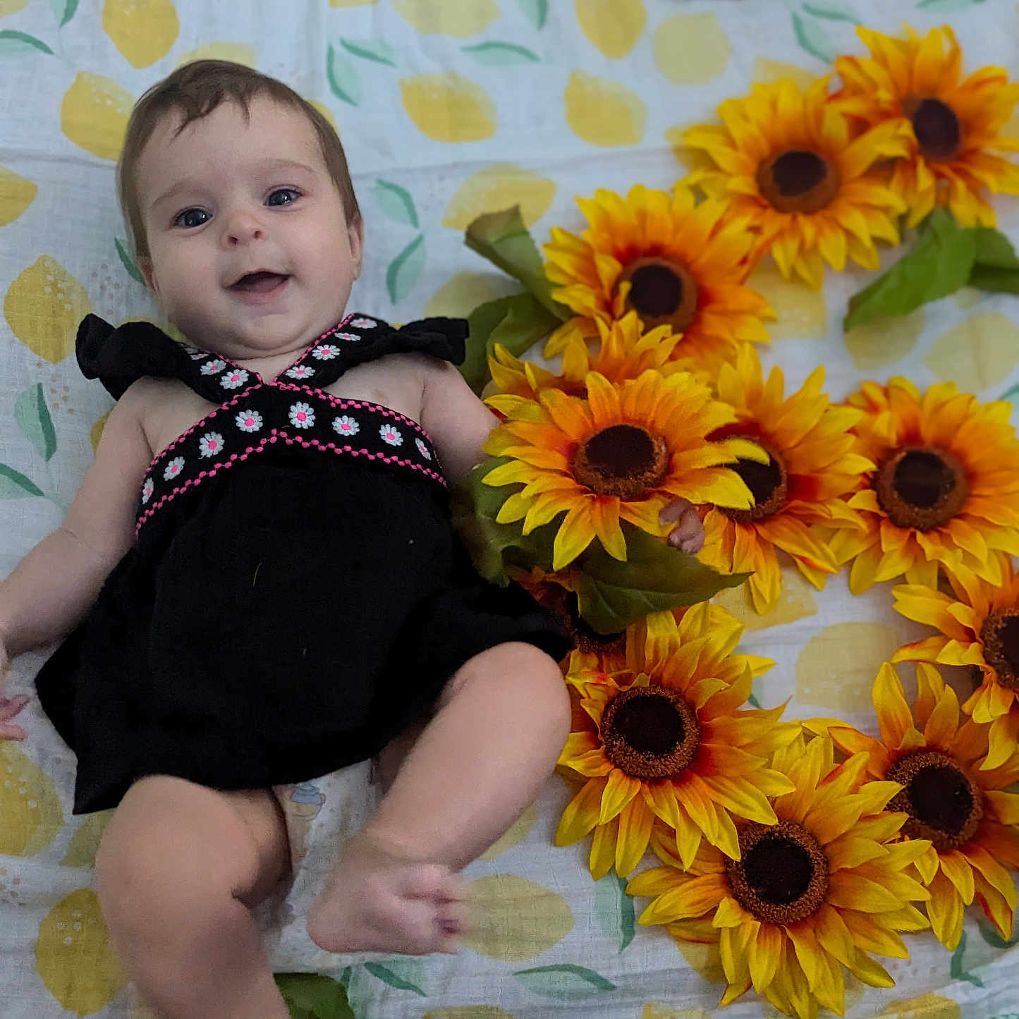 Clementine joined the competition — help win amazing prizes! baby, bodypart, clothing, daisy, dress, face, finger, flower, flowerarrangement, flowerbouquet, hand, head, leaf, pattern, person, petal, photography, plant, portrait, sunflower