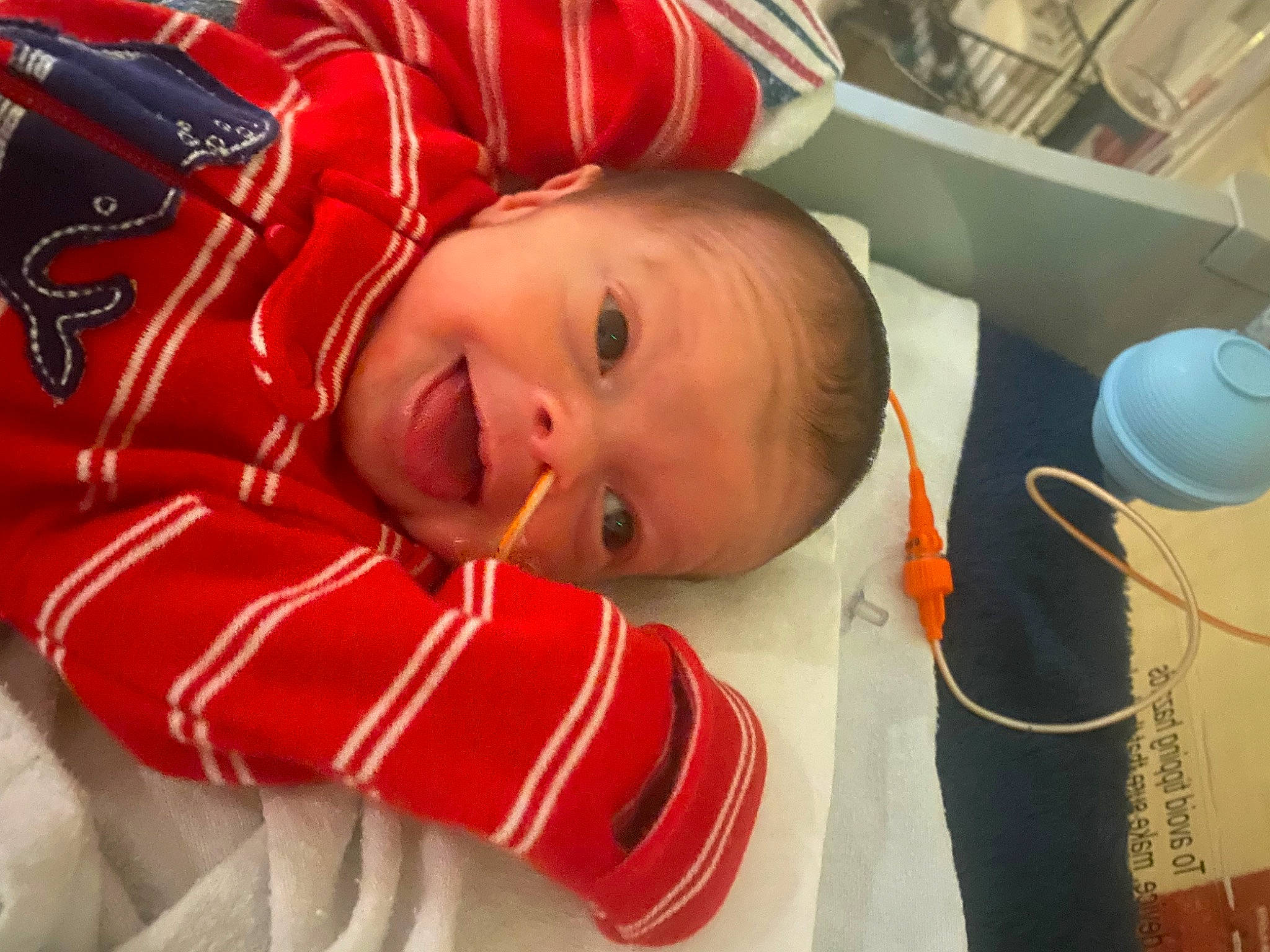 Isaac joined the competition — help win amazing prizes! baby, baby_products, baby_safety, baby_toddler_clothing, bed, child, comfort, facial_expression, flooring, fun, happy, linens, person, room, sleep, sleeve, smile, toddler