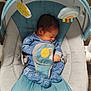 David is registered to the contest to win money with this photo: baby, newborn, sleeping, blue, rocker, plush_toys, sun, rainbow, clothing, footed_pajamas, infant, comfort, indoor, wooden_floor, child, cute, peaceful, seat, soft, rest