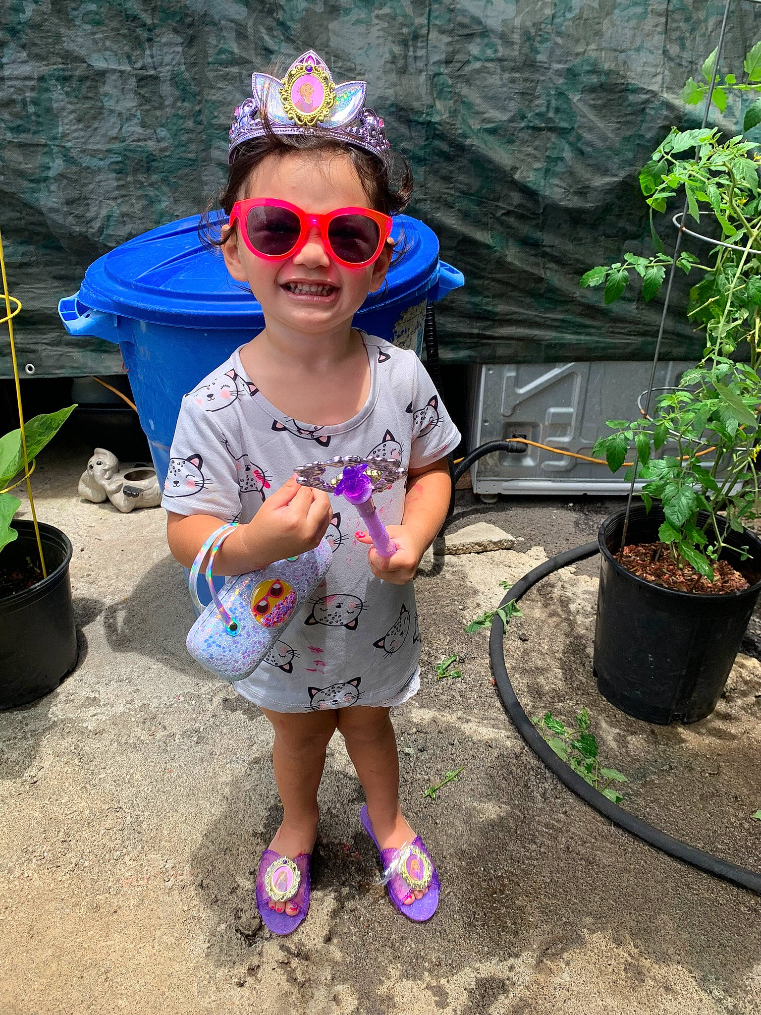 Aleia is registered to the contest to win money with this photo: baby_toddler_clothing, cap, cool, electric_blue, eyewear, flowerpot, goggles, grass, happy, hat, headgear, houseplant, joy, leisure, person, pink, plant, recreation, smile, sunglasses