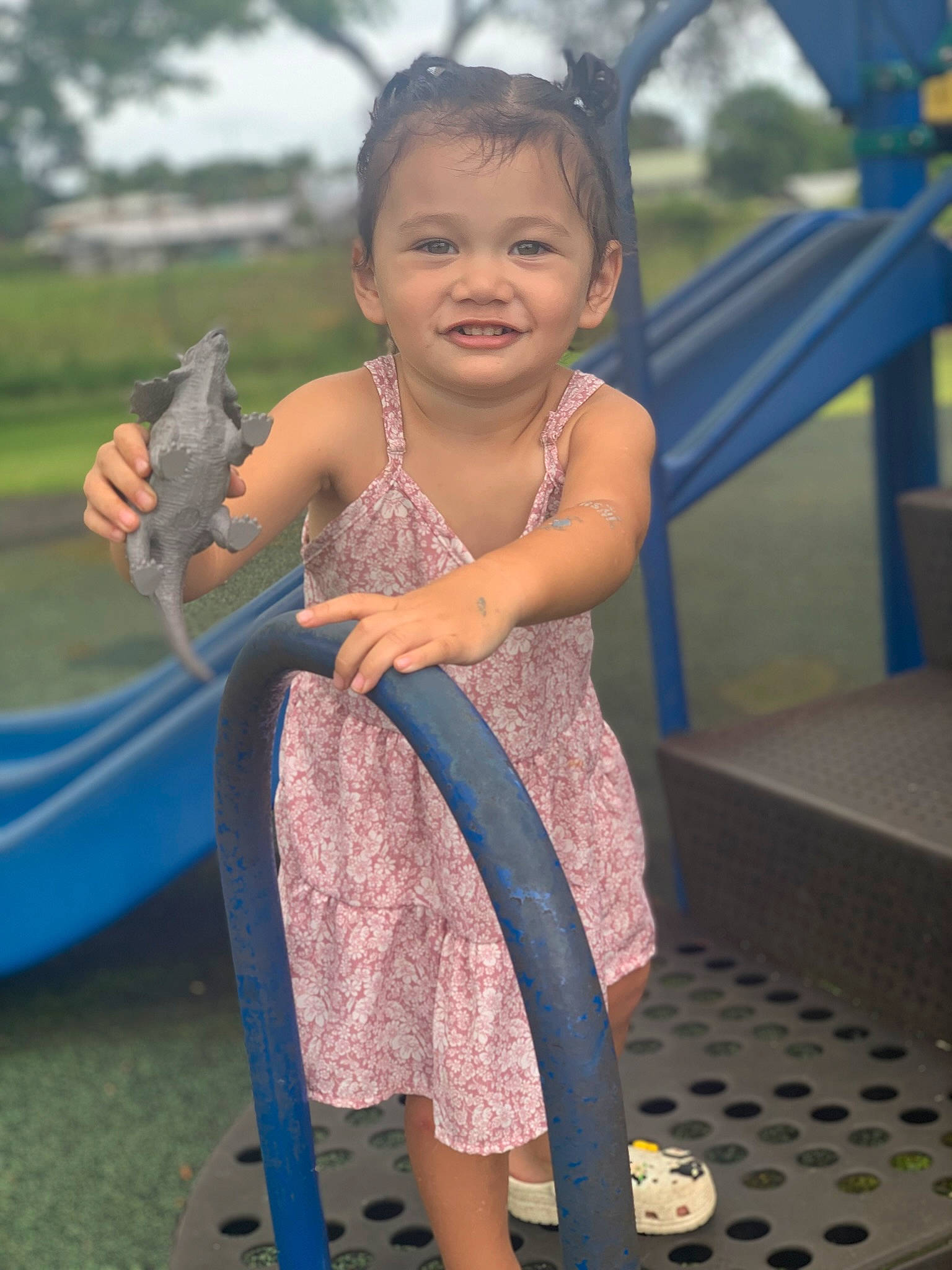 Aleia is registered to the contest to win money with this photo: boats_and_boating_equipment_and_supplies, child, event, fun, grass, happy, human_body, human_leg, joy, leisure, outdoor_play_equipment, person, play, recreation, sandal, sitting, skin, smile, thigh, toddler