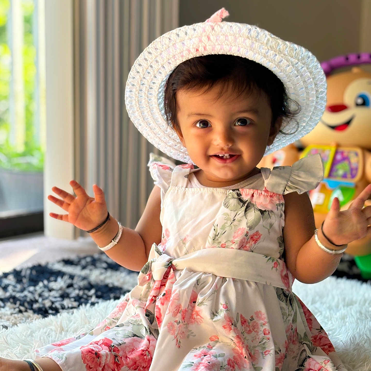 Shreya is registered to the contest to win money with this photo: accessories, baby, bodypart, bonnet, bracelet, clothing, costume, dress, face, finger, hand, hat, head, homedecor, jewelry, person, photography, portrait, sitting, sunhat