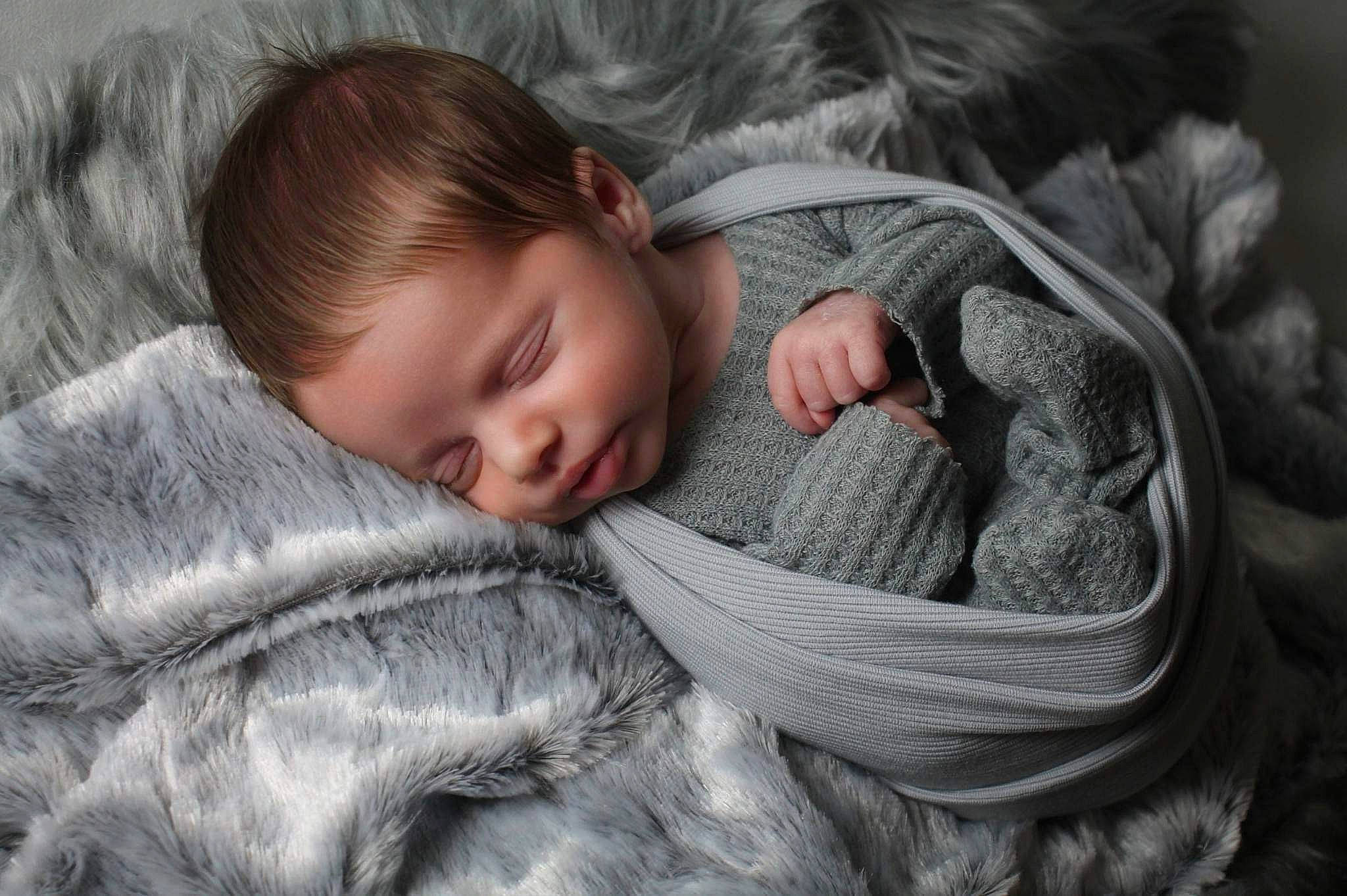 Enzo is registered to the contest to win money with this photo: baby, beauty, bedtime, cheek, child, close_up, comfort, fur, gesture, grey, human, linens, nap, nose, person, portrait_photography, skin, sleeve, textile, toddler