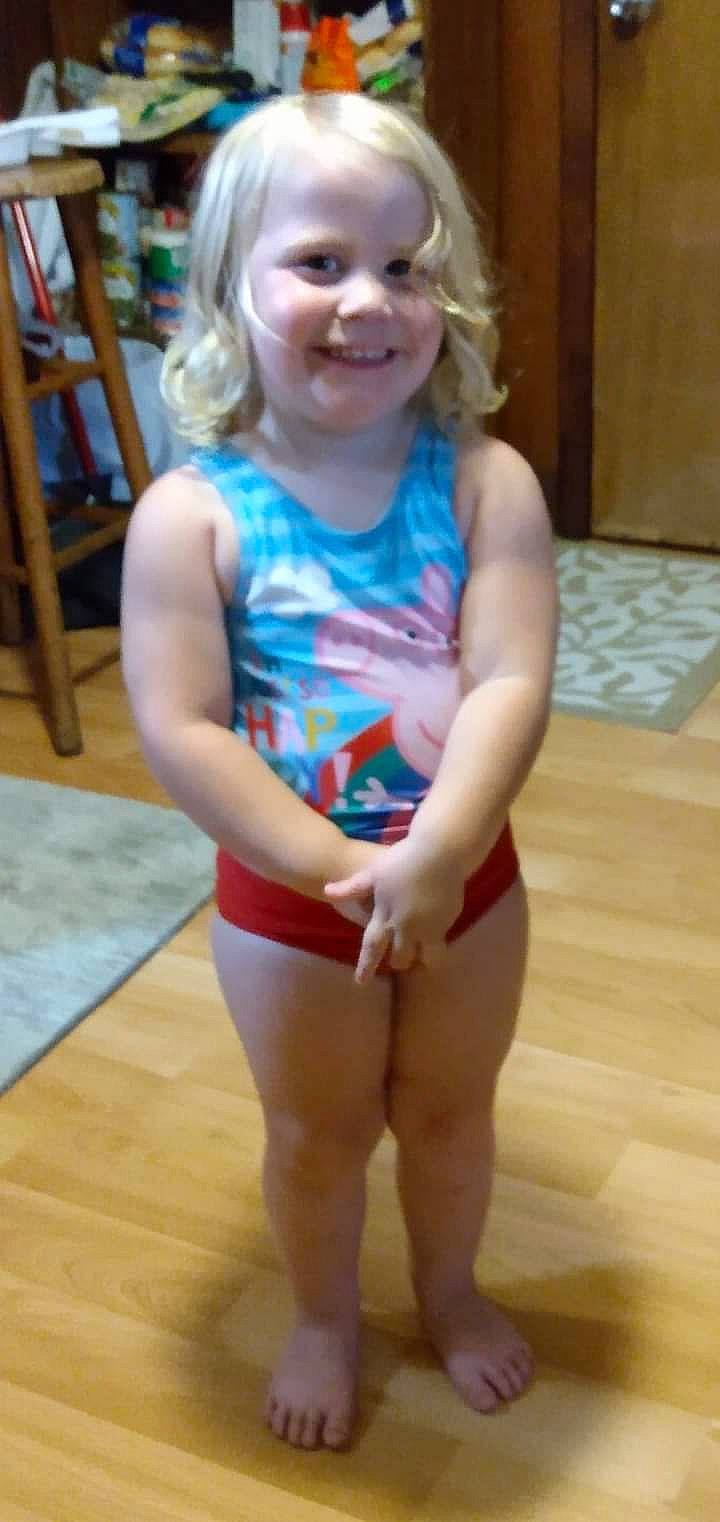 Hannah is registered to the contest to win money with this photo: active_tank, baby_toddler_clothing, face, flooring, fun, hair, happy, joint, joy, knee, leg, leisure, mouth, one_piece_swimsuit, person, shoulder, skin, smile, sportswear, thigh