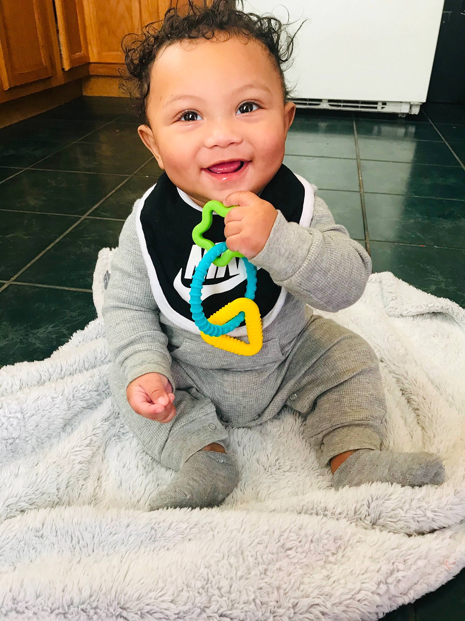 Kannon joined the competition — help win amazing prizes! baby, baby_toddler_clothing, cheek, child, chin, cool, crawling, face, floor, flooring, happy, head, joy, long_sleeved_t_shirt, nose, person, sitting, skin, sleeve, smile
