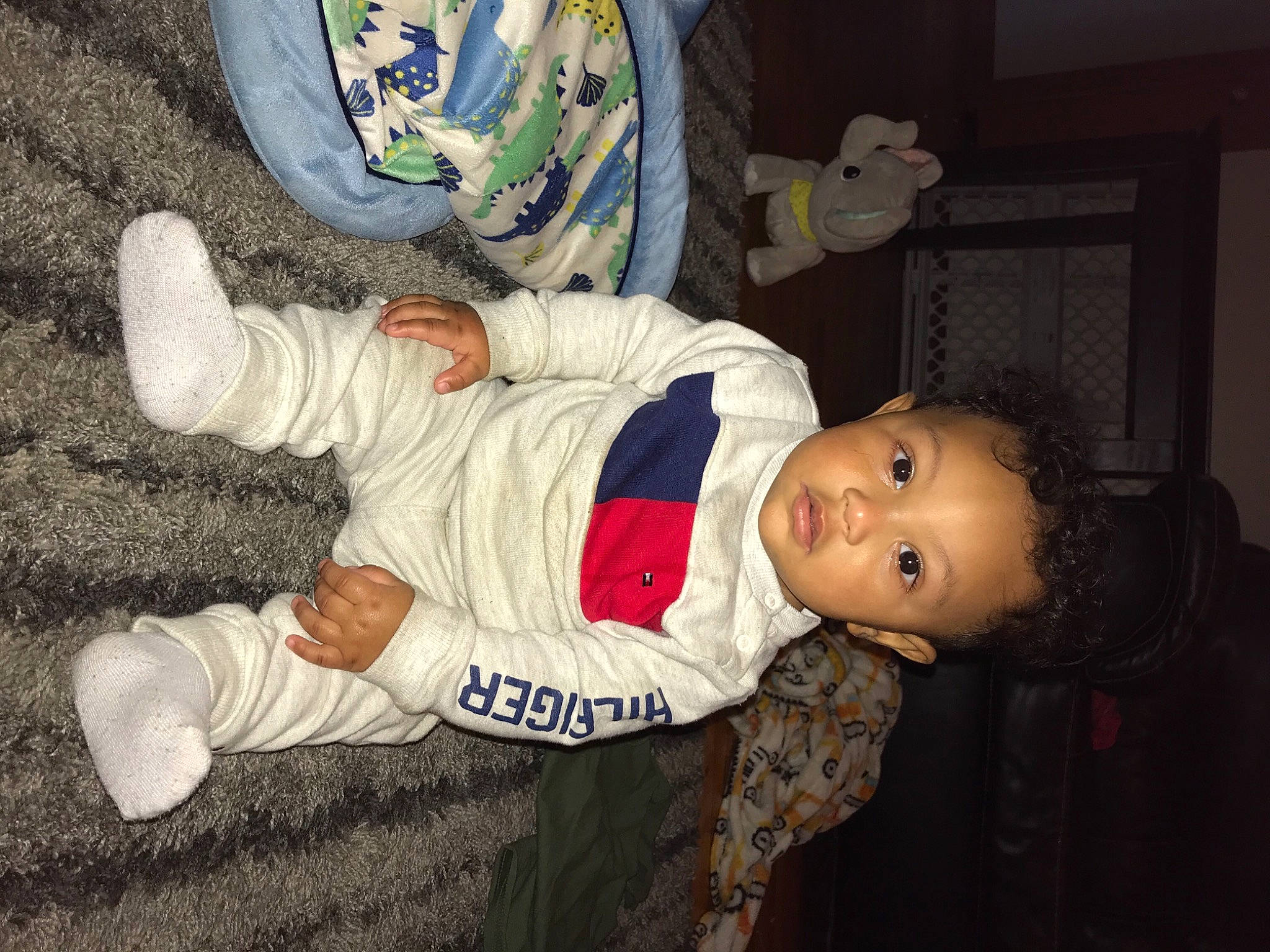 Kannon is registered to the contest to win money with this photo: baby, baby_toddler_clothing, carmine, child, comfort, flooring, fun, hat, head, human_body, person, room, sleeve, smile, space, toddler, walking_shoe