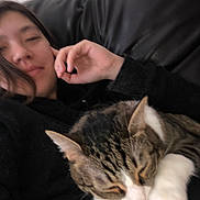 Hercules joined the competition — help win amazing prizes! cat, tabby_cat, white_paws, sleeping, person, face, portrait, selfie, couch, indoor, home, relaxing, dark_clothing, hand, closeup, pet, furry, whiskers, cozy, casual