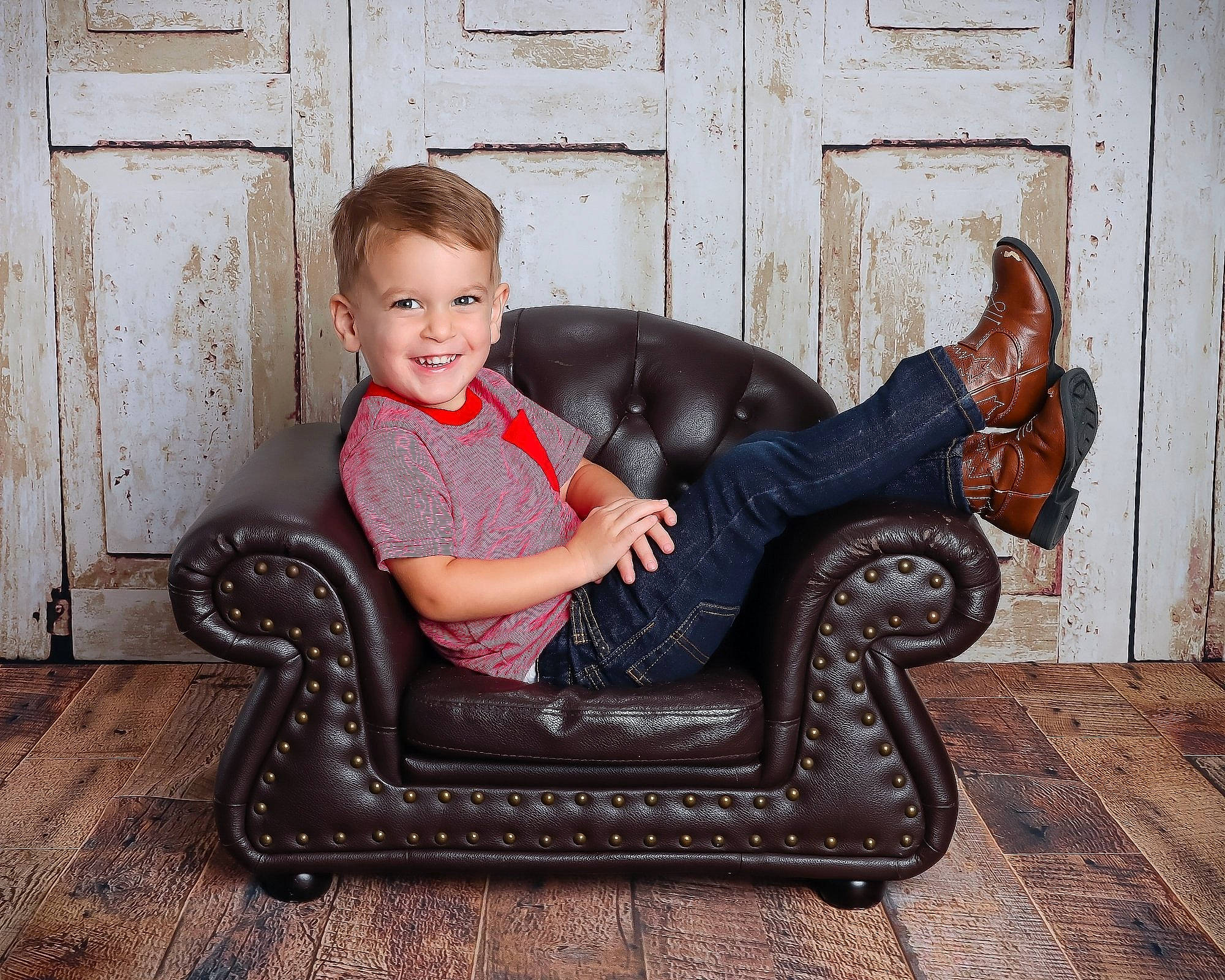 Jackson is registered to the contest to win money with this photo: armrest, chair, club_chair, comfort, flash_photography, fun, furniture, hairstyle, happy, human, human_leg, joy, lap, living_room, mammal, person, room, sitting, smile, thigh
