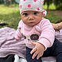 baby, child, infant, outdoor, grass, blanket, cap, polka_dots, pink_sweater, panda_face, socks, curious, young_child, cute, portrait, person, hand, sitting, nature, soft_clothing