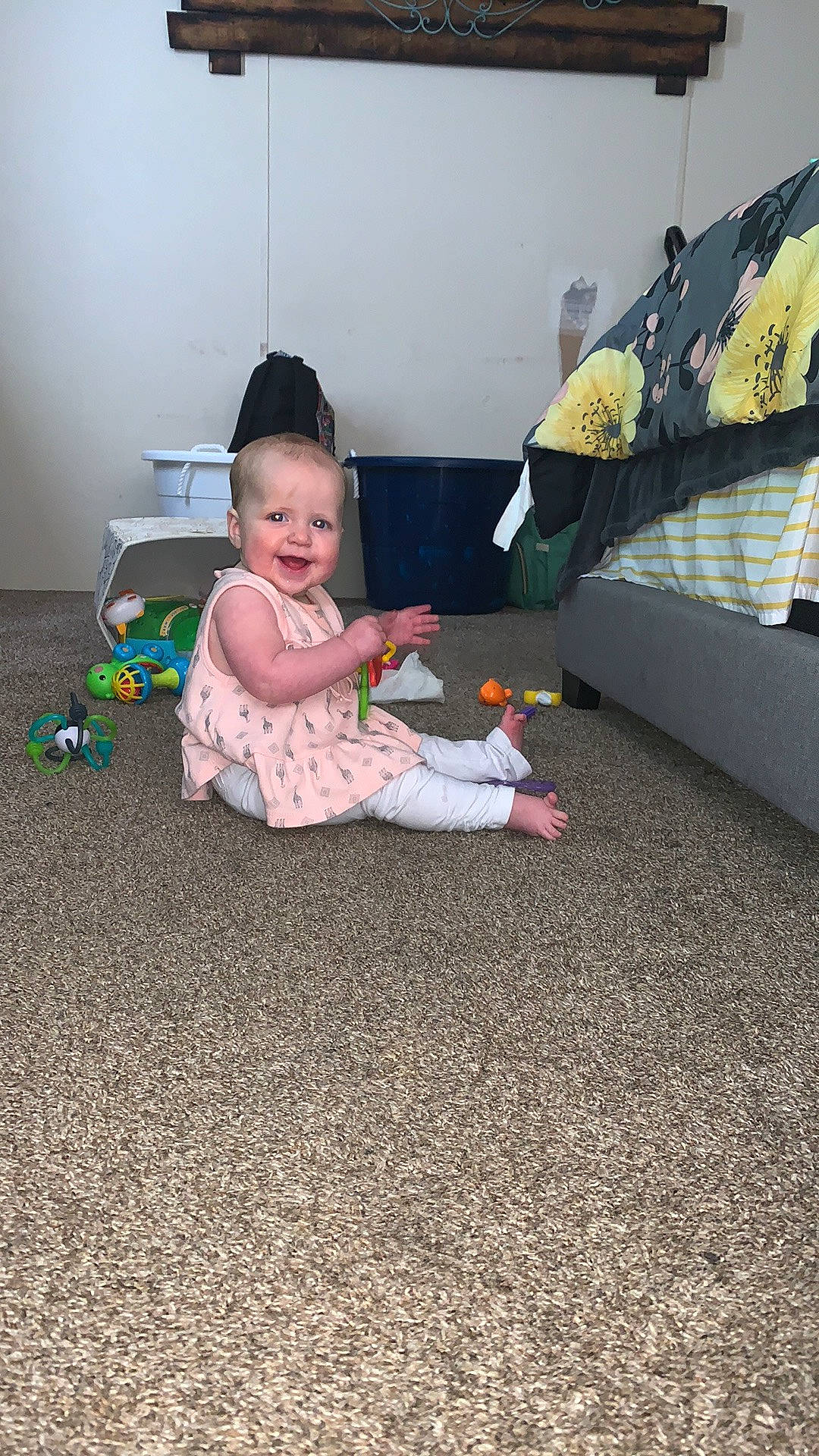 Delayni is registered to the contest to win money with this photo: baby, baby_toddler_clothing, carpet, child, comfort, floor, flooring, foot, fun, grass, human_leg, joy, living_room, pattern, person, play, room, sitting, toddler, wood