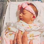 Emily joined the competition — help win amazing prizes! newborn, baby, infant, hospital, crib, blanket, pink_headband, tattooed_hand, rings, sleeping, wrapped, closeup, person, skin, bed, soft, cute, peaceful, resting, indoors