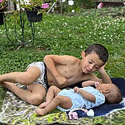 Thiago a rejoint le concours — aidez-le/la à gagner de superbes lots ! child, baby, brother, siblings, outdoor, grass, blanket, pacifier, toy, relaxing, nature, cute, family, lawn, summer, shirtless, infant, young, playing, bonding