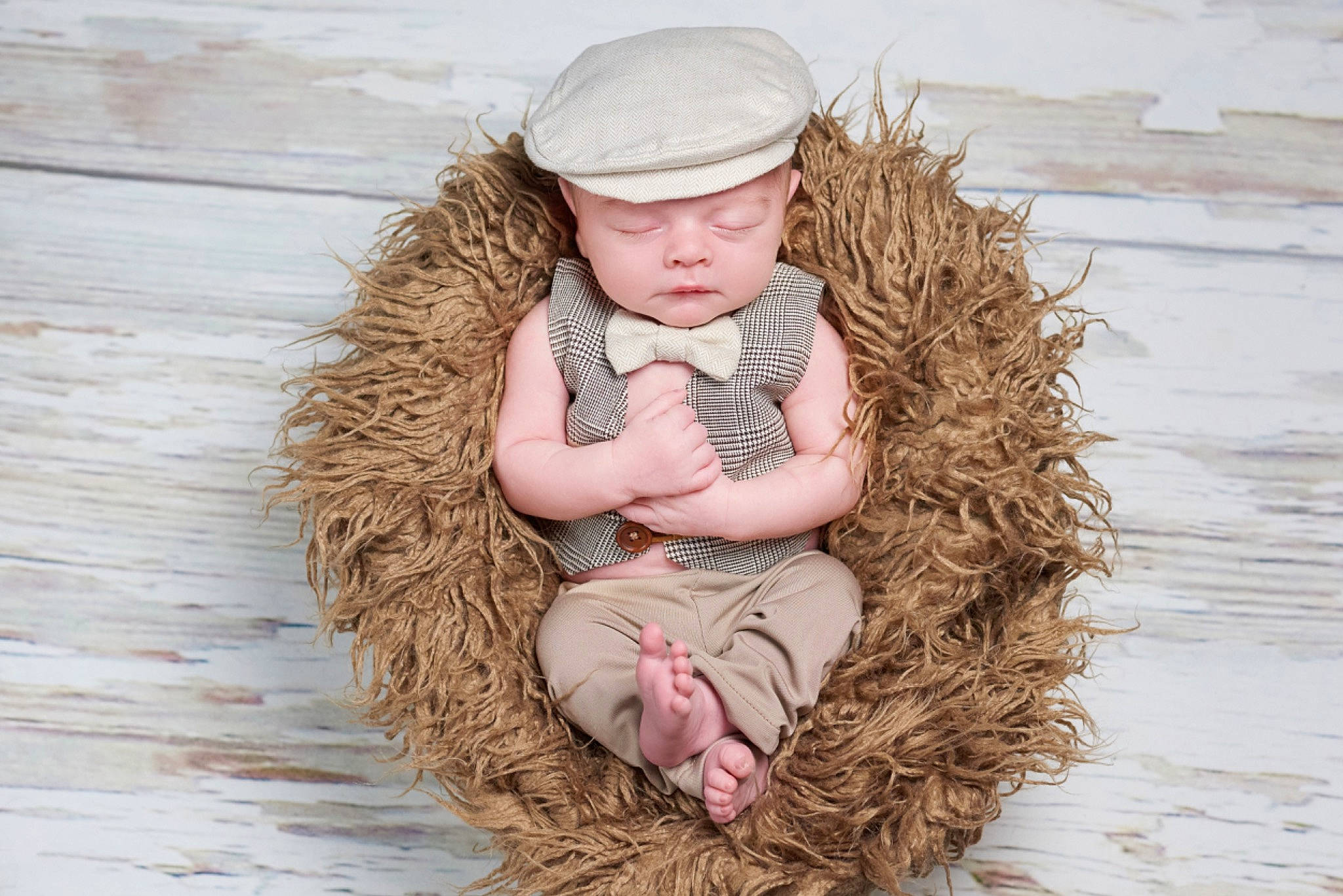 Eli is registered to the contest to win money with this photo: baby, baby_toddler_clothing, brown_hair, cap, child, clothing, eye, face, fawn, fun, fur, grass, happy, hat, head, headwear, outerwear, people_in_nature, person, sitting