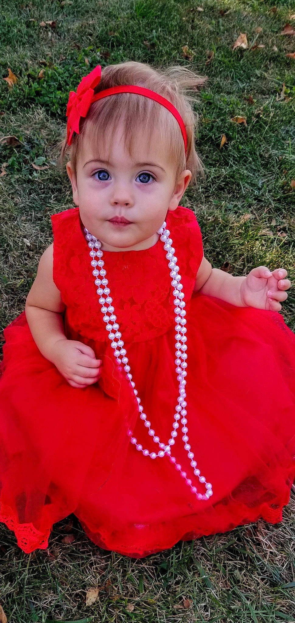 Rosalyn joined the competition — help win amazing prizes! child, child_model, clothing, costume, dress, fashion_accessory, hair_accessory, headband, headgear, outerwear, pattern, person, pink, red, smile, toddler
