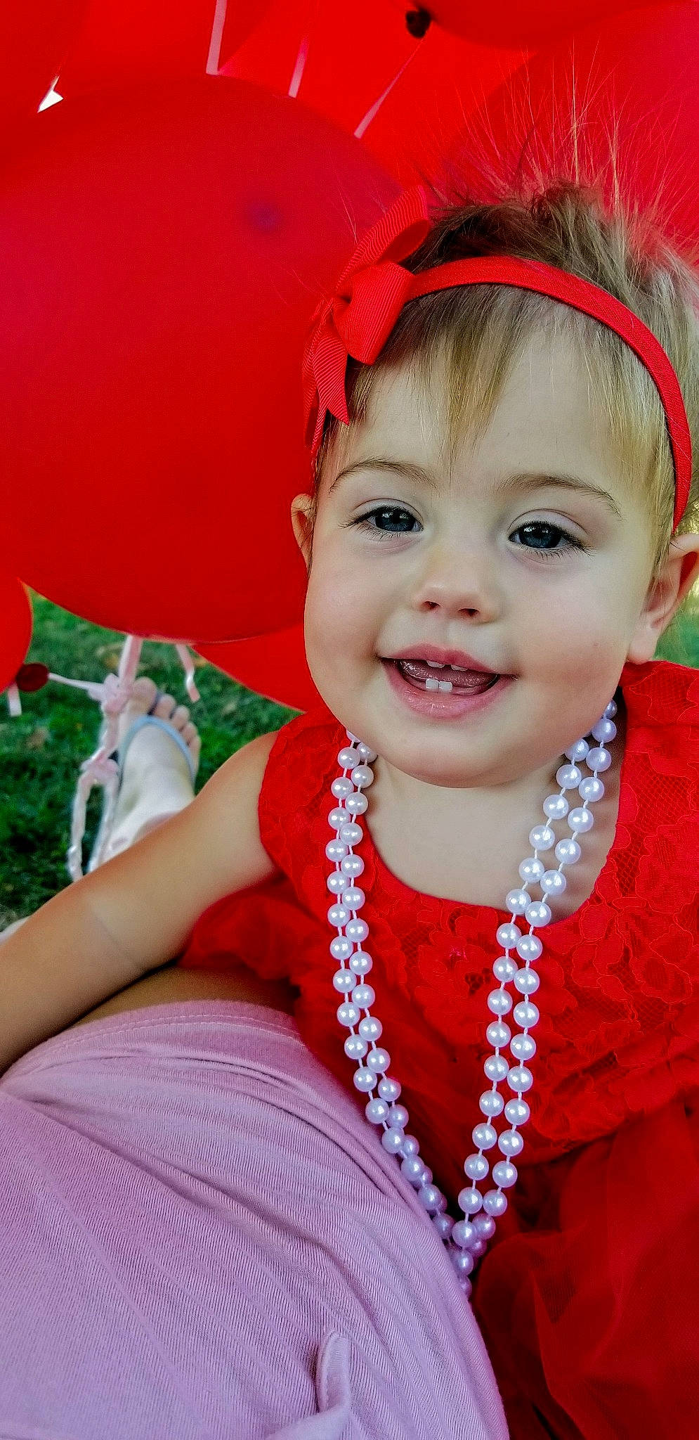 Rosalyn is registered to the contest to win money with this photo: baby, cheek, child, child_model, fashion_accessory, hair_accessory, happy, headband, headgear, headpiece, joy, pearl, person, red, skin, smile, toddler