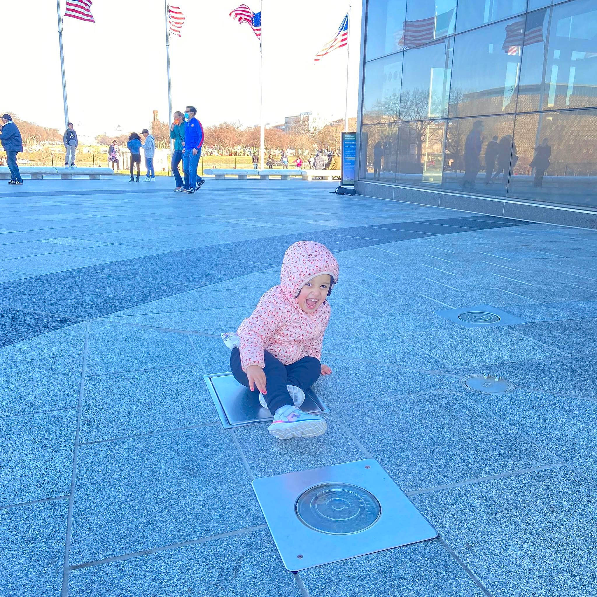 Aashvee joined the competition — help win amazing prizes! asphalt, blue, building, child, city, electric_blue, flooring, fun, grass, headwear, leisure, pedestrian, person, recreation, road, road_surface, rolling, shadow, sidewalk, sky