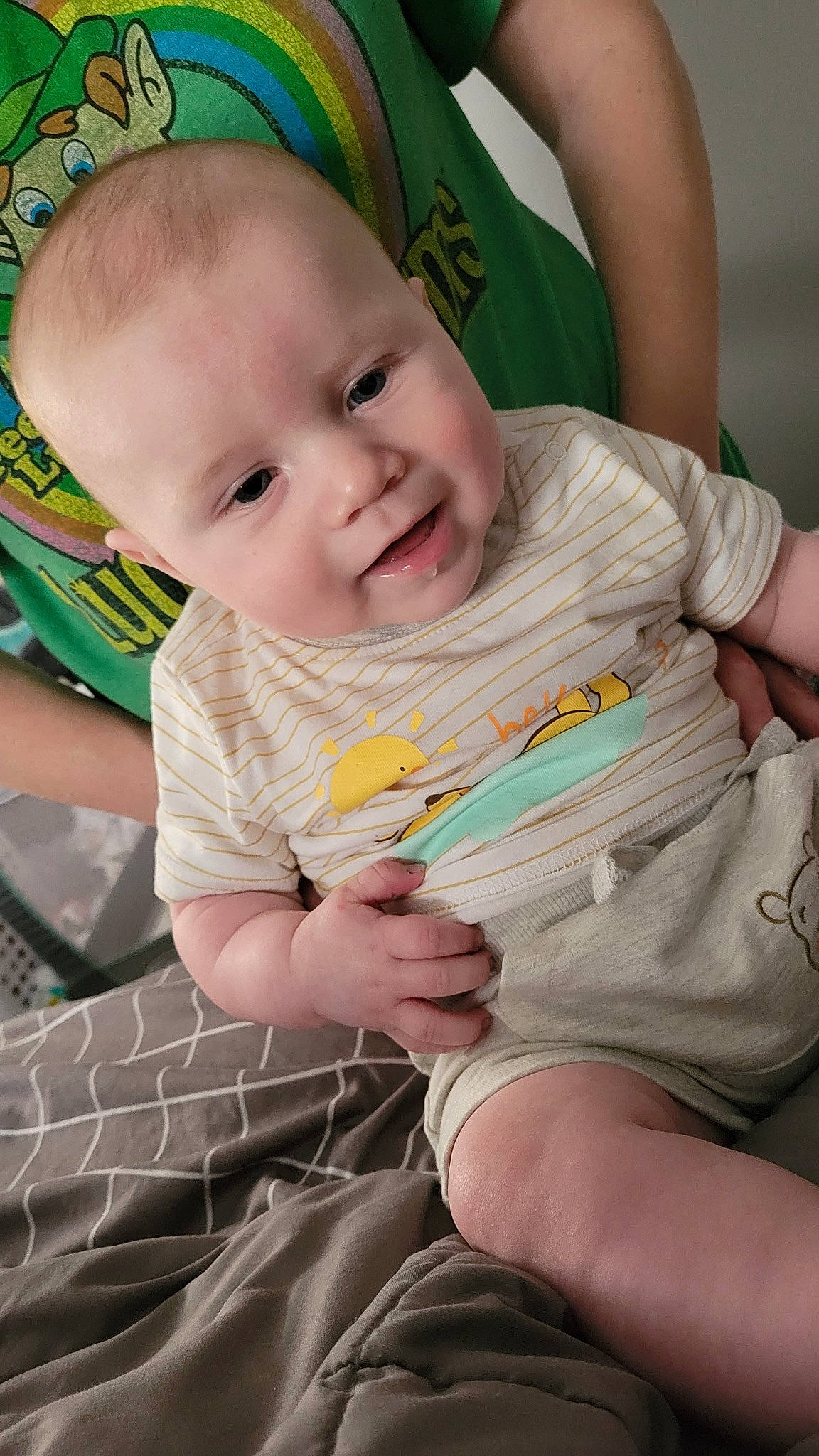 George joined the competition — help win amazing prizes! baby, baby_products, baby_toddler_clothing, chair, cheek, chest, child, comfort, eye, finger, fun, green, happy, head, iris, lap, person, sitting, skin, smile