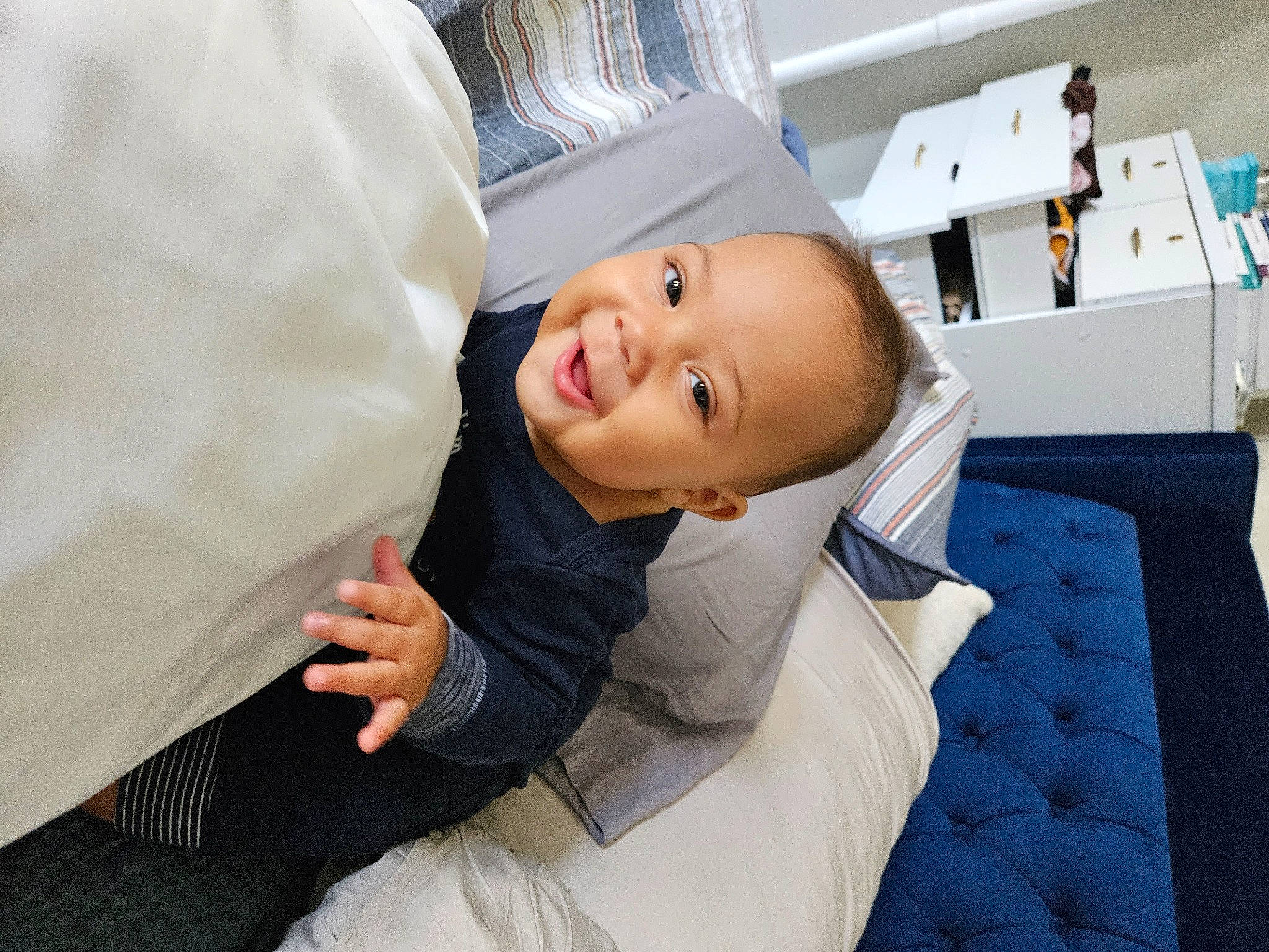 Eli joined the competition — help win amazing prizes! baby, bridal_clothing, ceremony, child, comfort, event, flash_photography, formal_wear, fun, happy, hat, laugh, linens, person, portrait_photography, room, sitting, smile, suit, toddler