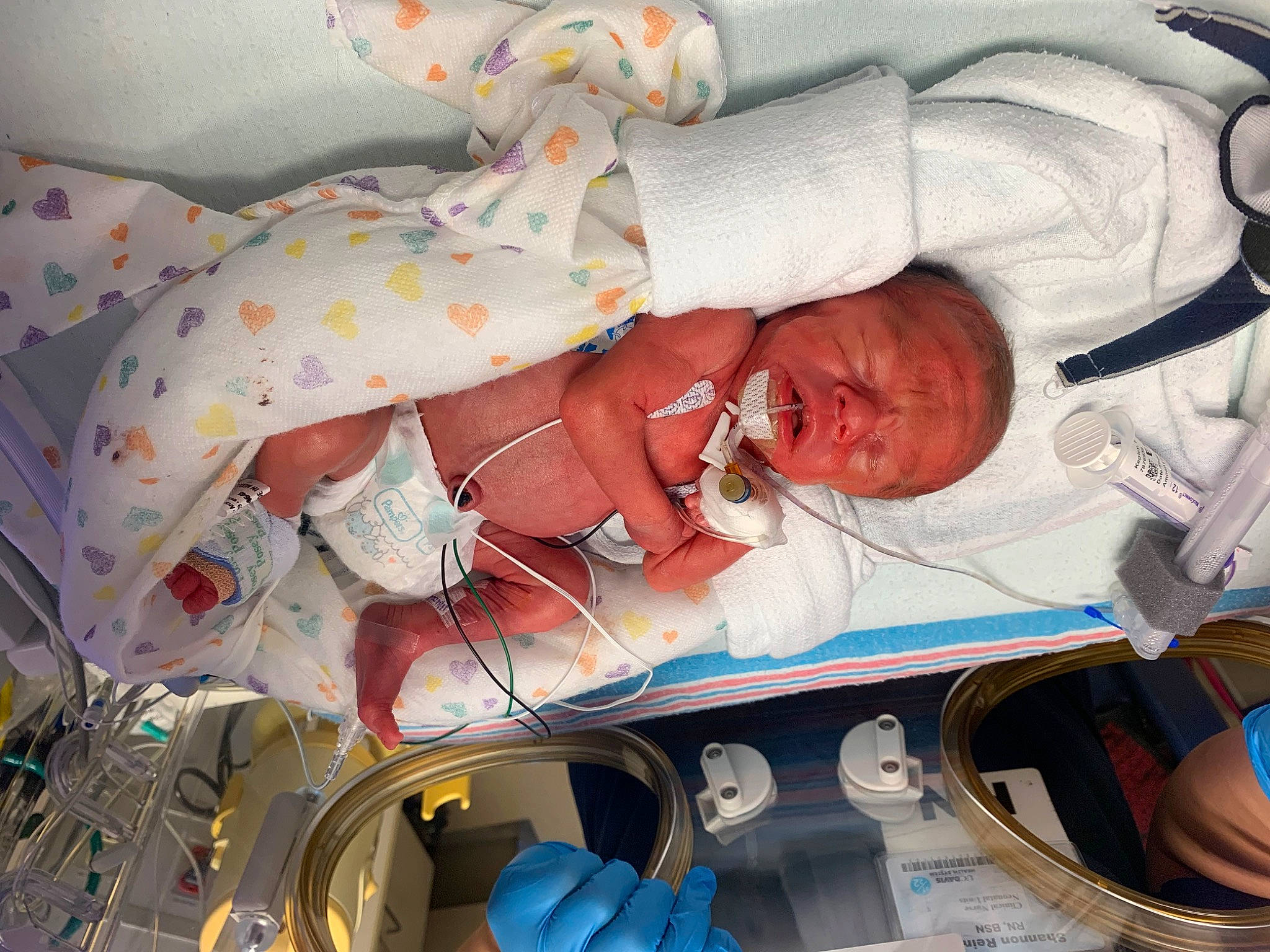 Keshawn is registered to the contest to win money with this photo: astronaut, baby, baby_products, baby_safety, carmine, child, comfort, event, head, health_care, human_body, linens, medical_equipment, mouth, person, product, room, service, skin, space