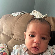 Miaya joined the competition — help win amazing prizes! baby, infant, child, couch, furniture, clothing, portrait, face, person, indoor, wall, fabric, soft, cute, young, sitting, expression, home, comfort, casual