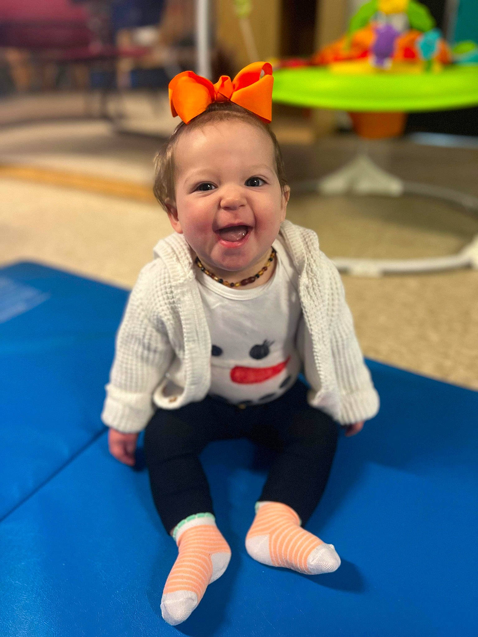 Wrenleigh is registered to the contest to win money with this photo: baby, baby_toddler_clothing, child, electric_blue, event, floor, flooring, fun, happy, head, leisure, person, play, playground, recreation, room, sitting, skin, sleeve, smile