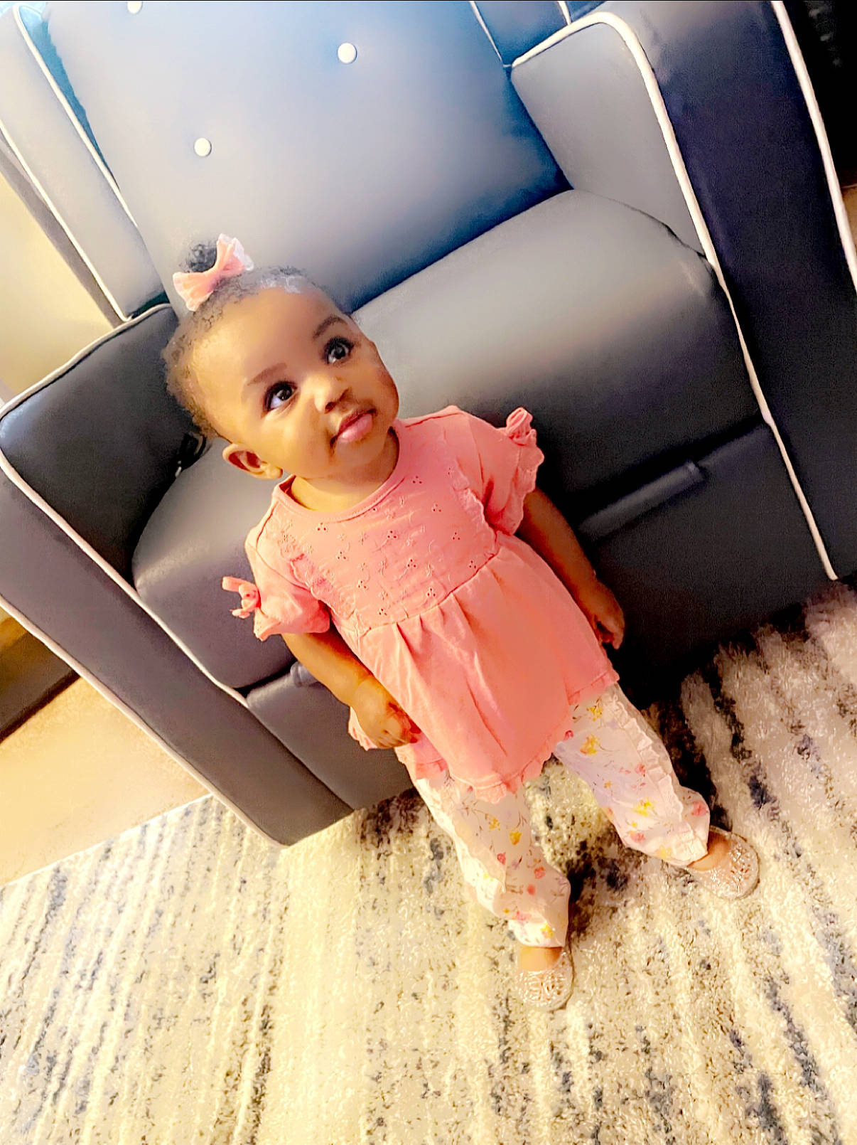 Ariyah is registered to the contest to win money with this photo: arm, automotive_design, automotive_exterior, baby, baby_toddler_clothing, child, comfort, floor, flooring, fun, hardwood, human_leg, material_property, person, product, sitting, skin, tints_and_shades, toddler, vehicle_door