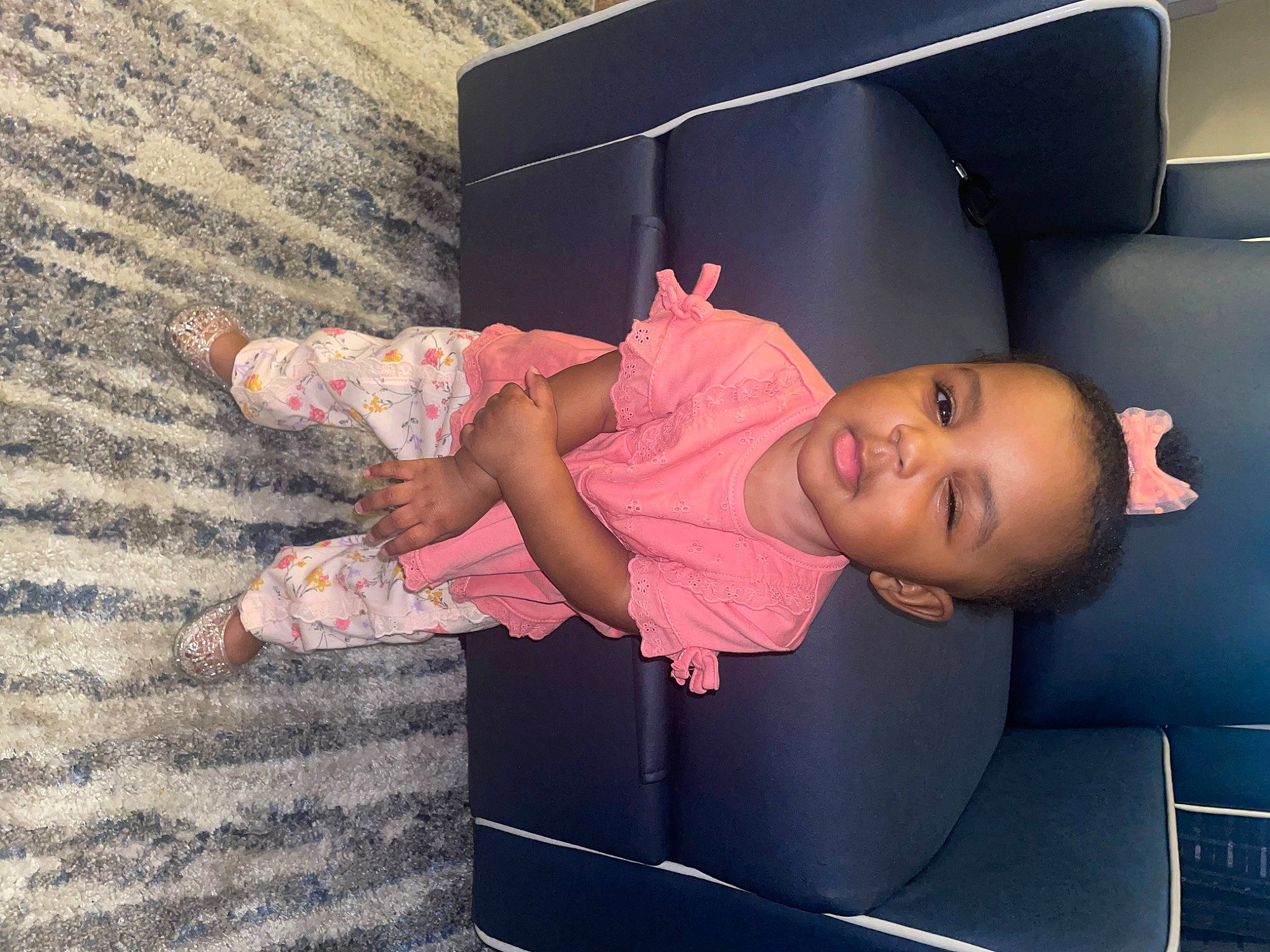 Ariyah is registered to the contest to win money with this photo: baby, baby_toddler_clothing, beauty, child, comfort, fun, hairstyle, human_leg, joint, leisure, motor_vehicle, person, pink, product, room, sitting, skin, sock, thigh, toddler
