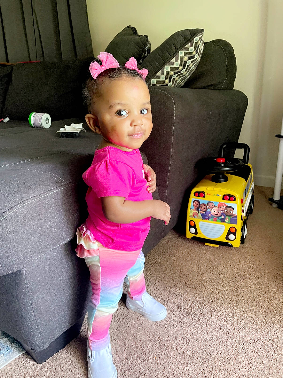 Ariyah joined the competition — help win amazing prizes! baby, baby_toddler_clothing, child, couch, facial_expression, fashion_accessory, flooring, fun, happy, magenta, mammal, person, pink, purple, sitting, sock, textile, toddler, toy, trunk