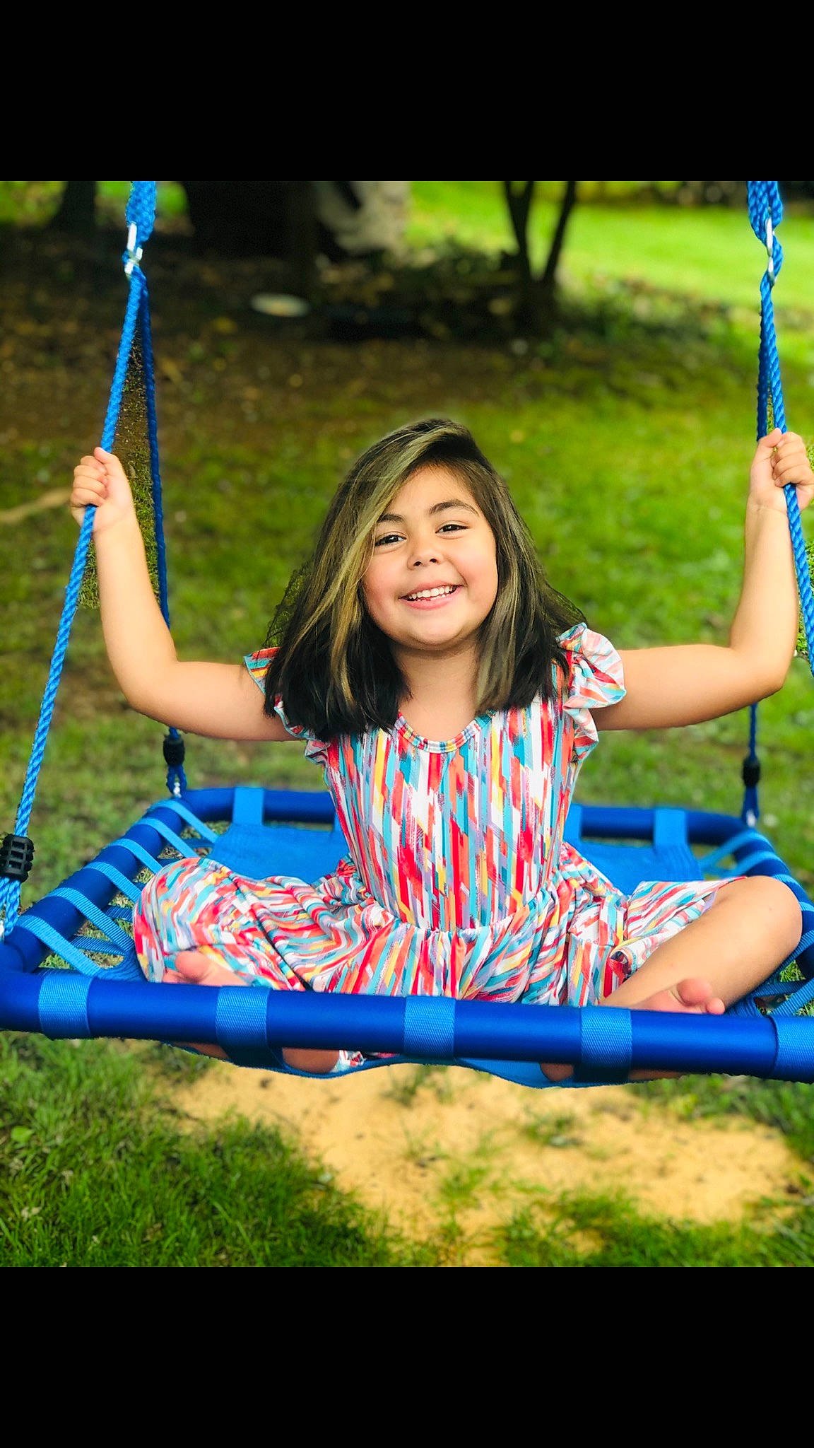 Evelyn is registered to the contest to win money with this photo: beauty, electric_blue, facial_expression, fun, happy, joy, leisure, majorelle_blue, nature, outdoor_play_equipment, outdoor_recreation, people_in_nature, person, play, public_space, recreation, sitting, spring, style, summer