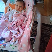 Ailyn joined the competition — help win amazing prizes! baby, newborn, blanket, pink, baby_rocker, animal_prints, indoor, carpet, wooden_furniture, face, infant, child, cute, cozy, sleepwear, home, portrait, comfortable, baby_clothing, resting