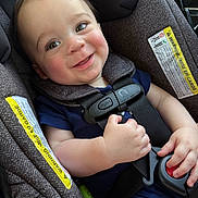 Mason is registered to the contest to win money with this photo: baby, car_seat, harness, smiling, child, infant, seatbelt, cute, face, cheeks, clothing, sitting, hand, safety, closeup, person, indoors, happy, young, transport