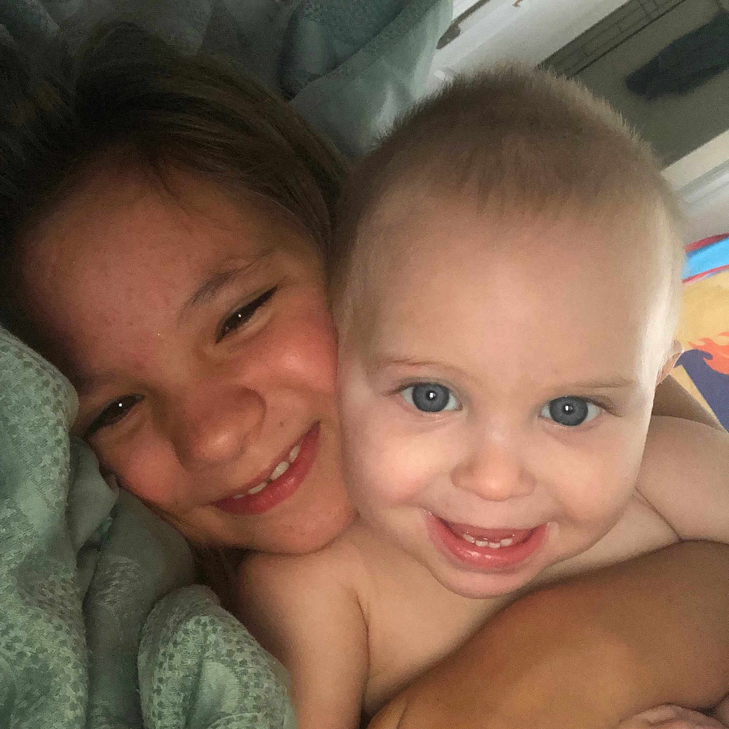 Atlas is registered to the contest to win money with this photo: baby, bed, blanket, bodypart, cushion, face, furniture, happy, head, homedecor, indoors, laughing, mouth, newborn, person, photography, portrait, selfie, smile, teeth