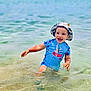 Nélyo a rejoint le concours — aidez-le/la à gagner de superbes lots ! beach, child, fun, happy, hat, holiday, ocean, outdoor, playful, sea, smiling, splashing, summer, sunny, swimsuit, toddler, vacation, water, waves, young_child