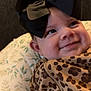 Kaylee joined the competition — help win amazing prizes! baby, bow, child, closeup, clothing, cozy, cute, face, floral, happy, headwear, indoors, infant, leopard_print, pattern, pillow, portrait, skin, smiling, young