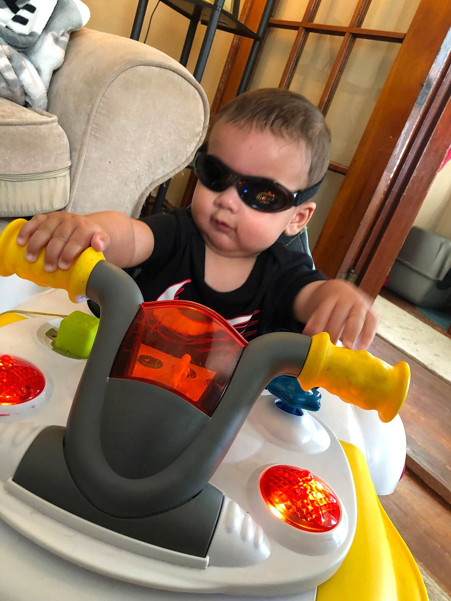 Jiovanni is registered to the contest to win money with this photo: child, eyewear, fictional_character, food, fun, glasses, person, toddler, vacation, vehicle