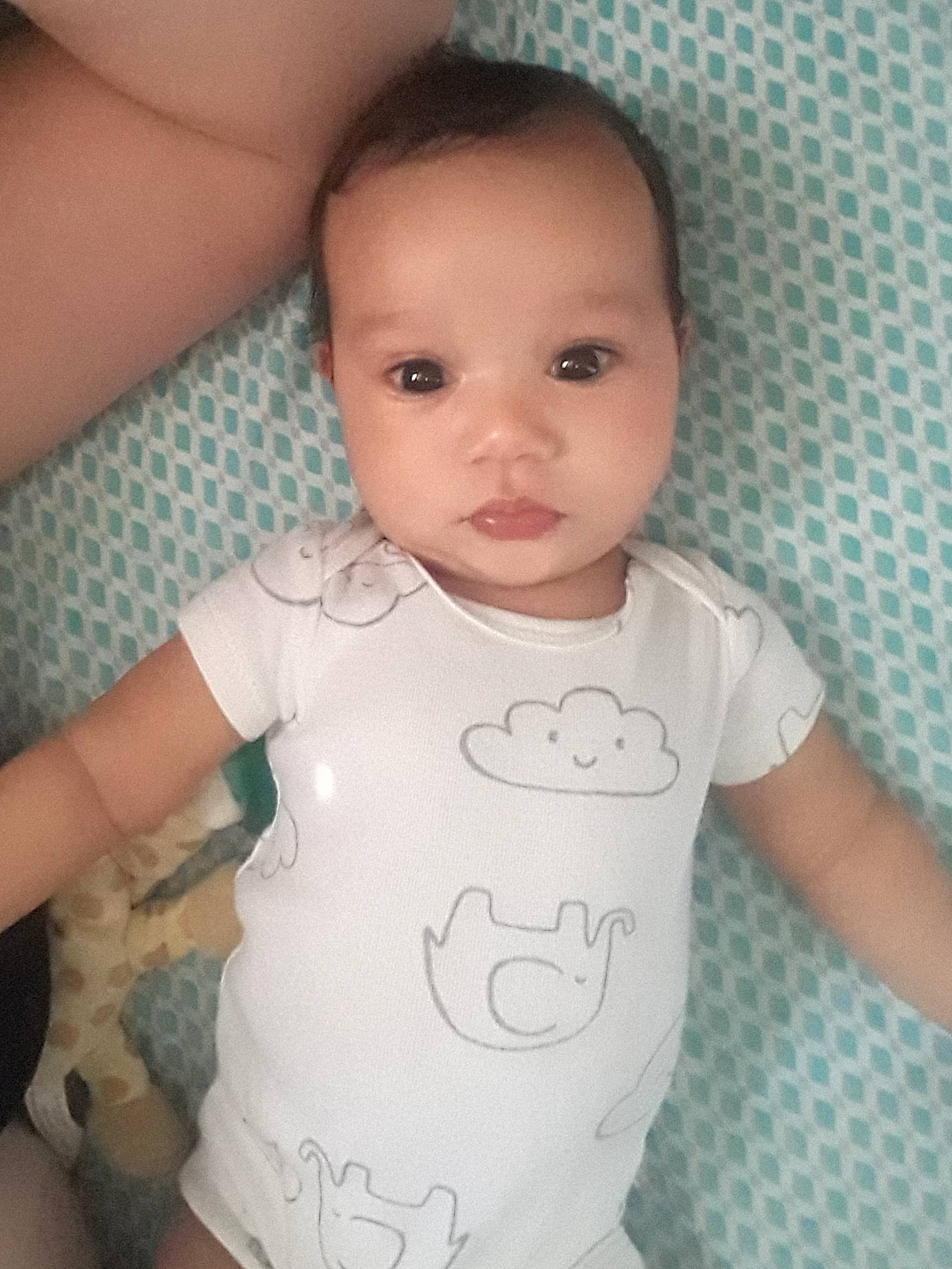 Nia is registered to the contest to win money with this photo: arm, baby, baby_toddler_clothing, beauty, cheek, child, eye, face, forehead, head, lip, neck, person, skin, sleeve, smile, t_shirt, toddler