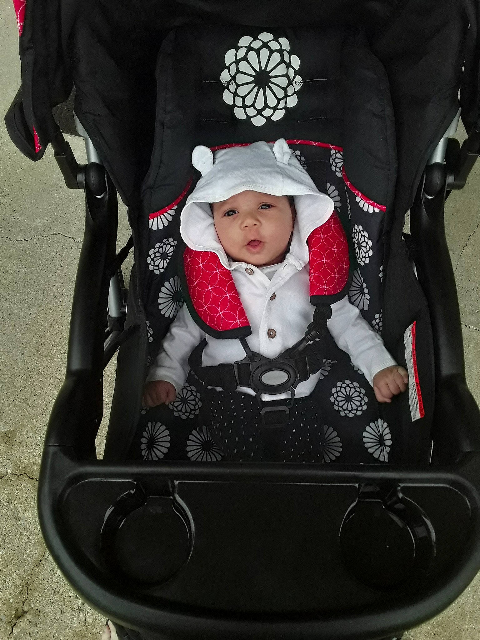 Nia joined the competition — help win amazing prizes! baby_carriage, baby_carrier, baby_products, car_seat, child, headwear, person, product, toddler