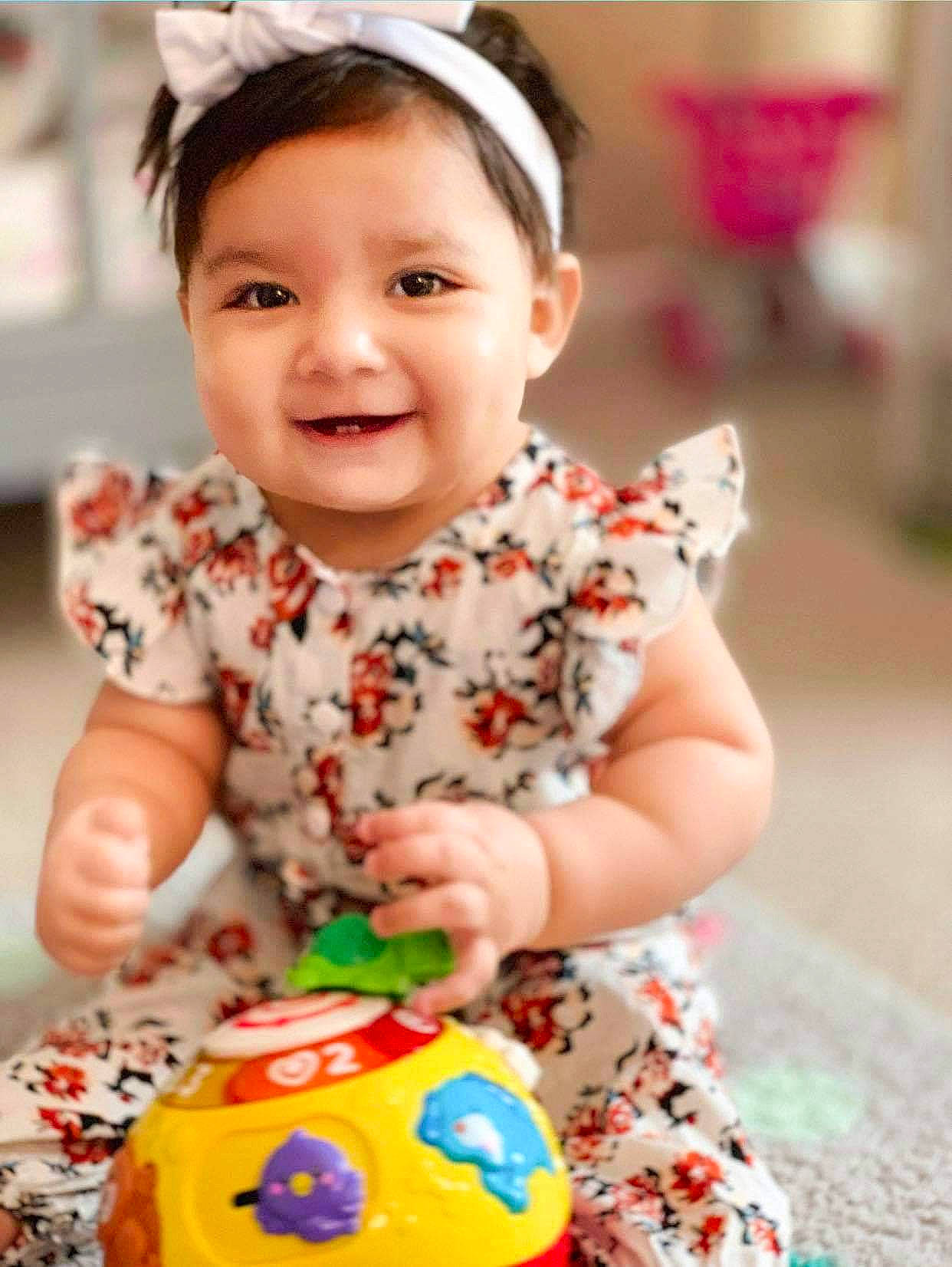 Aria joined the competition — help win amazing prizes! baby, baby_playing_with_toys, baby_toddler_clothing, child, hair_accessory, joy, person, play, smile, toddler